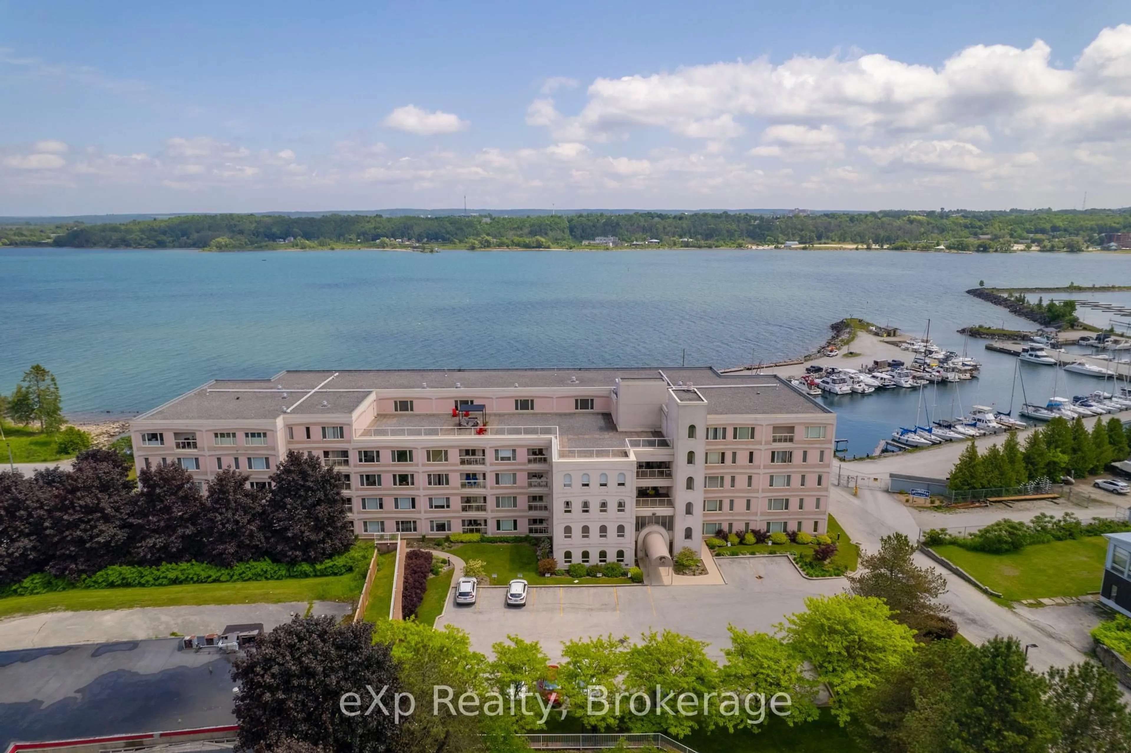 A pic from outside/outdoor area/front of a property/back of a property/a pic from drone, water/lake/river/ocean view for 2555 3rd Ave #309, Georgian Bluffs Ontario N4K 6T8