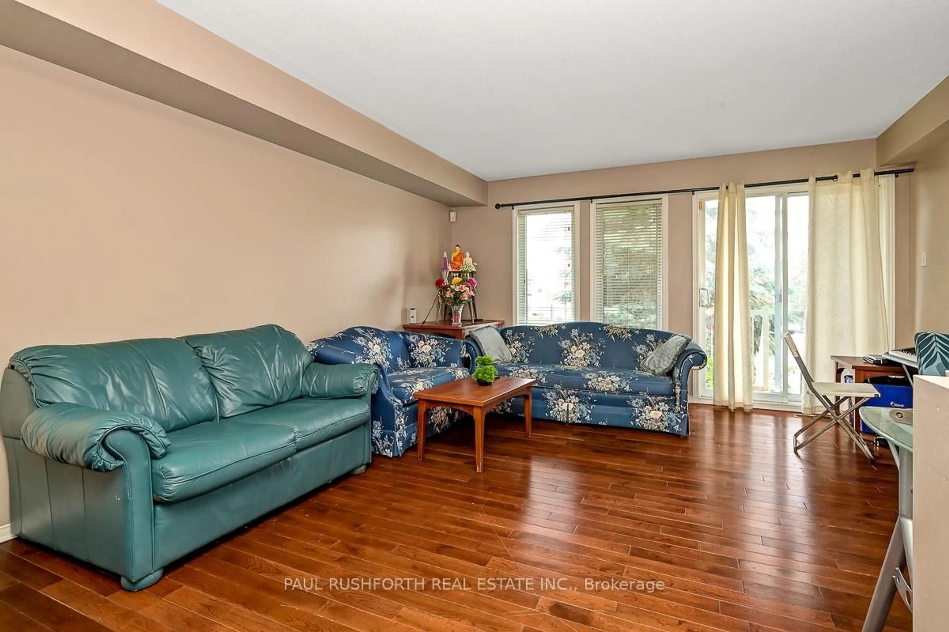 Living room with furniture, wood/laminate floor for 2232 Bois Vert Pl, Ottawa Ontario K4A 4T7