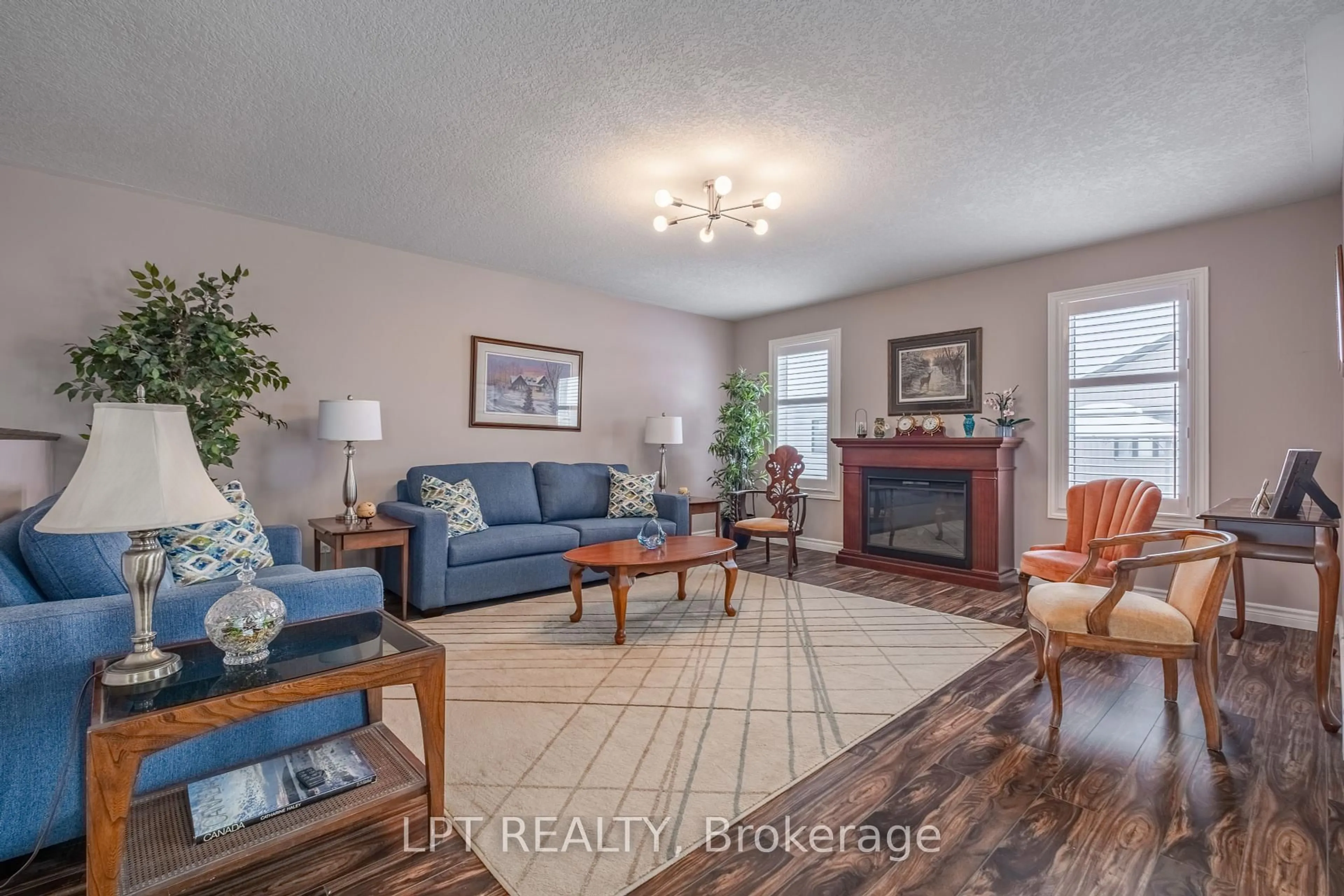 Living room with furniture, wood/laminate floor for 2 Merrill Dr, Prince Edward County Ontario K0K 3L0