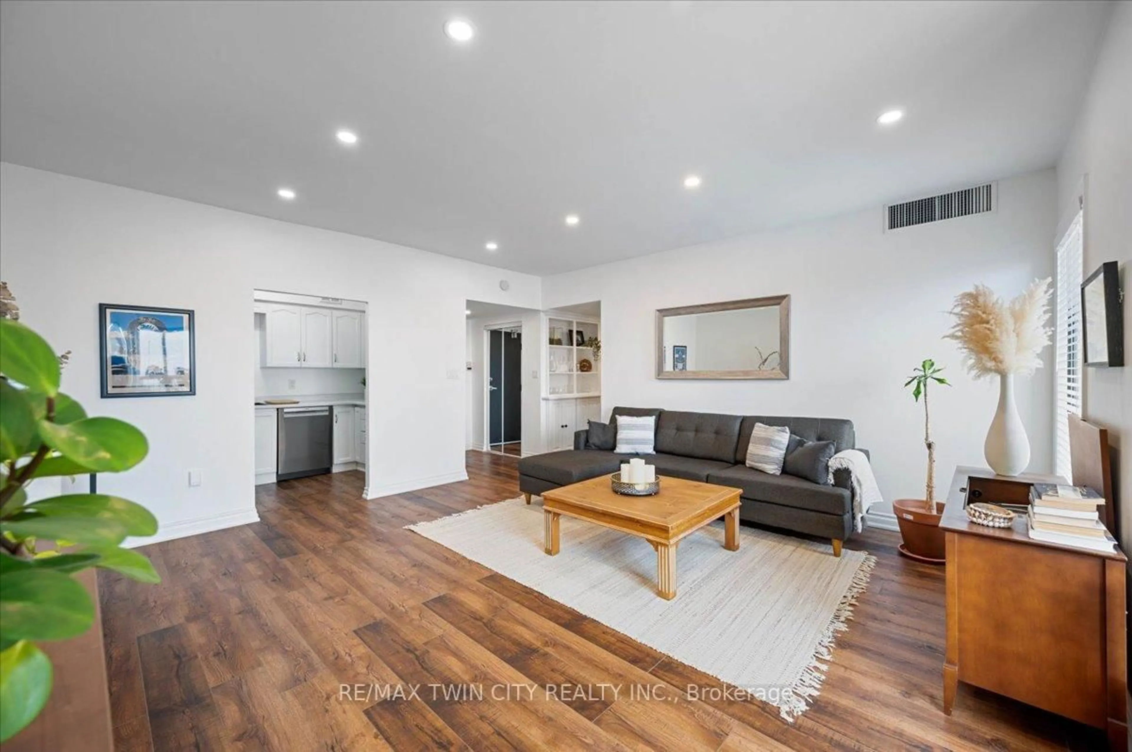 Living room with furniture, wood/laminate floor for 260 Sheldon Ave #809, Kitchener Ontario N2H 6P2