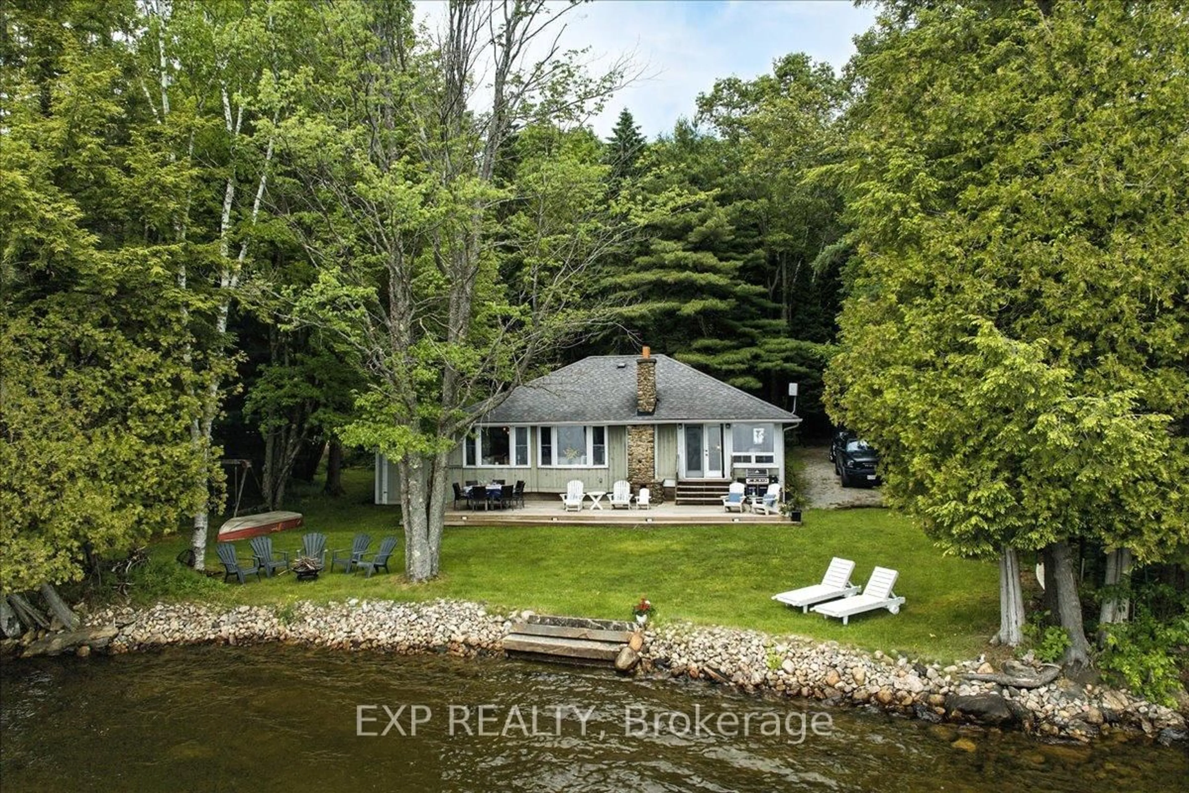 A pic from outside/outdoor area/front of a property/back of a property/a pic from drone, water/lake/river/ocean view for 1103 Dugan Rd, Minden Hills Ontario K0M 2K0
