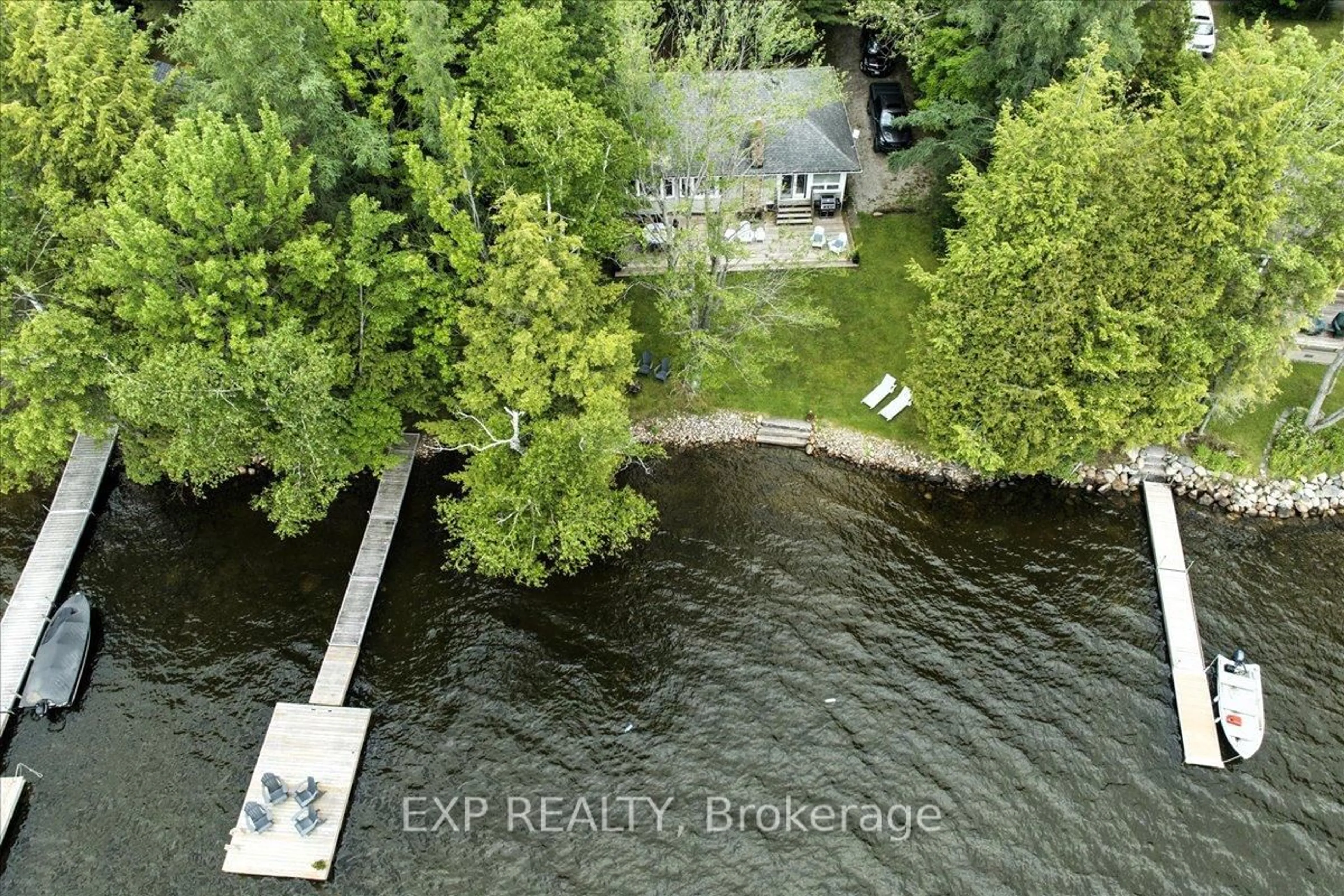 A pic from outside/outdoor area/front of a property/back of a property/a pic from drone, water/lake/river/ocean view for 1103 Dugan Rd, Minden Hills Ontario K0M 2K0