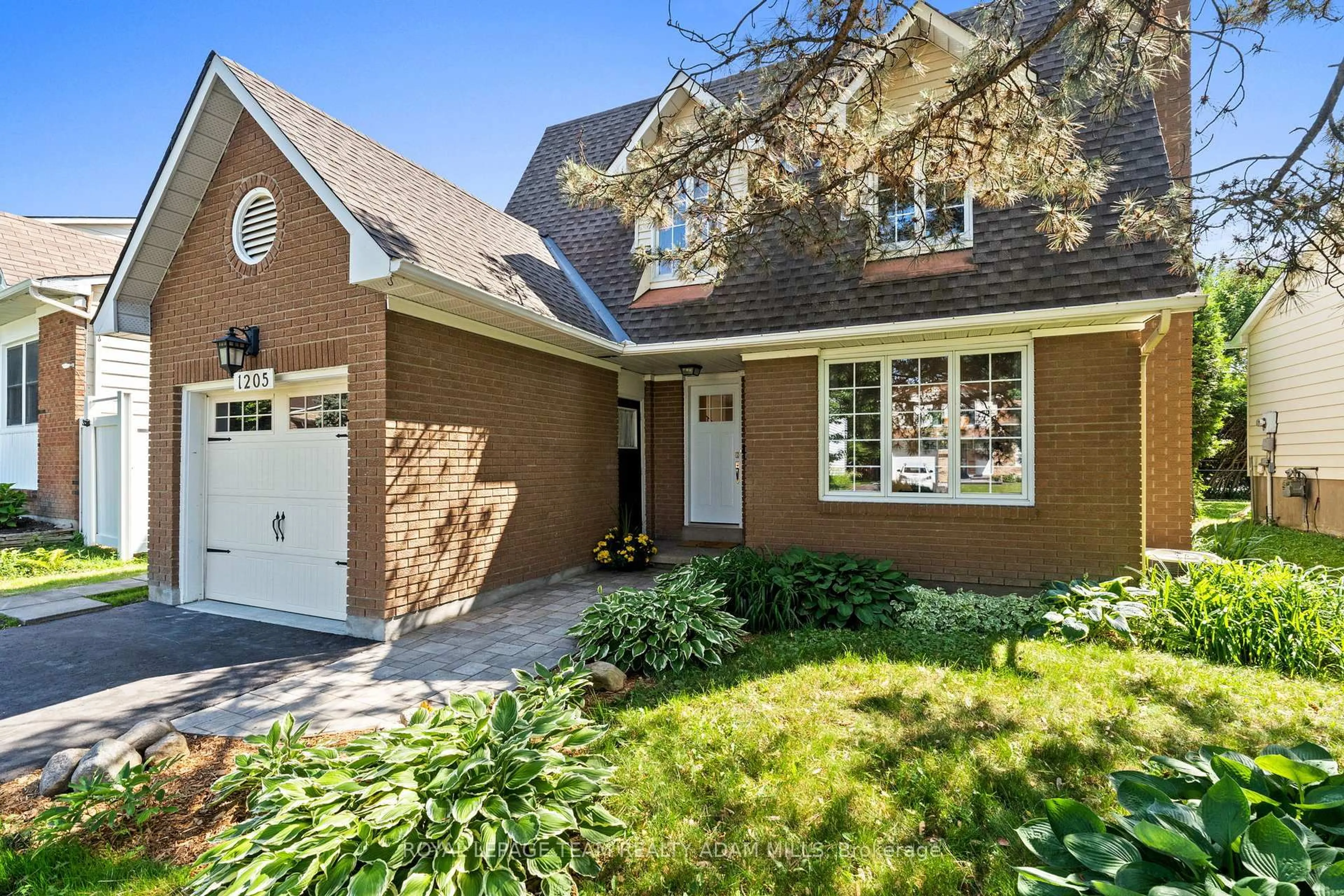 Home with brick exterior material, street for 1205 St. Moritz Crt, Ottawa Ontario K1C 2B2