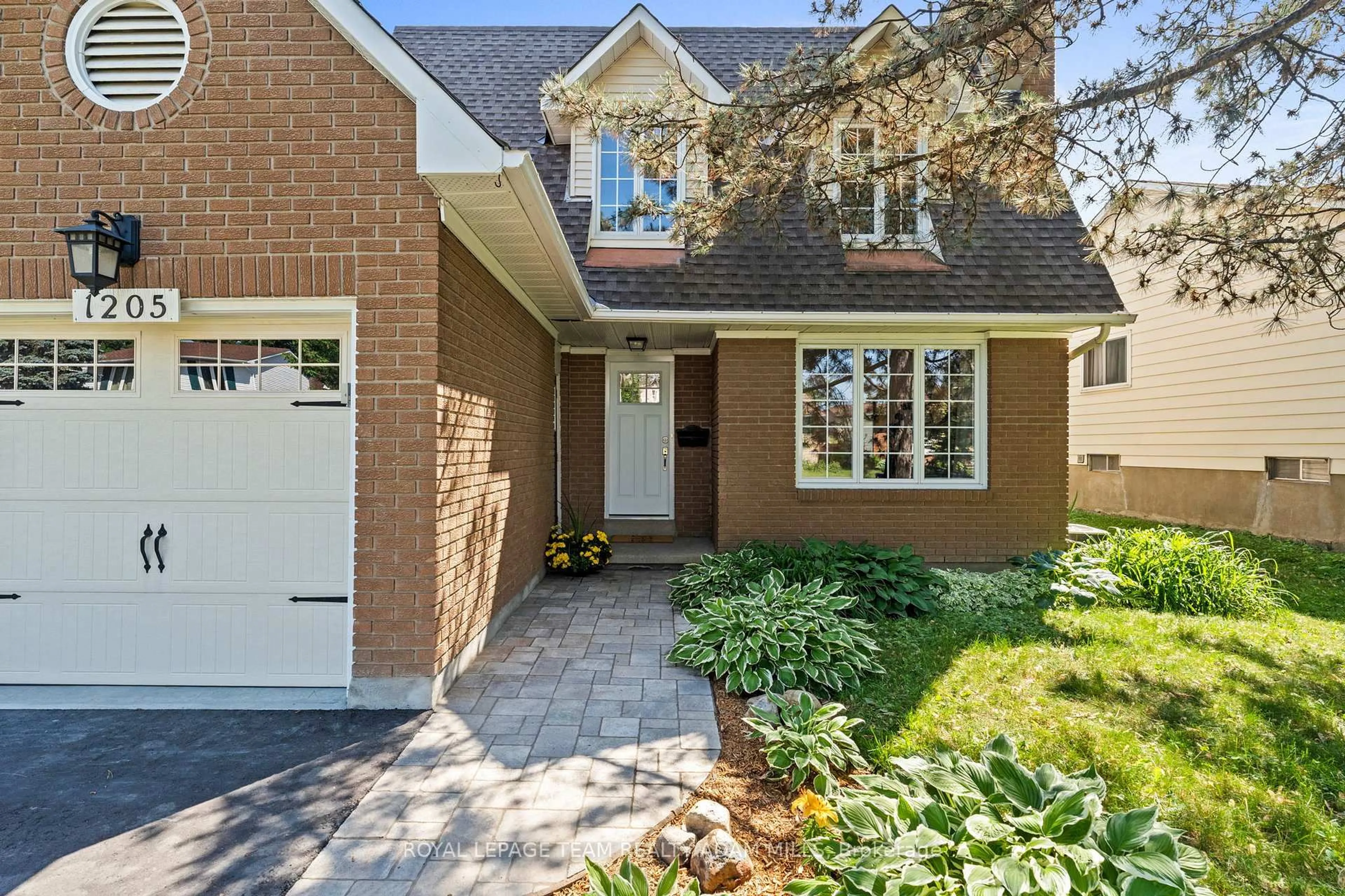 Home with brick exterior material, street for 1205 St. Moritz Crt, Ottawa Ontario K1C 2B2