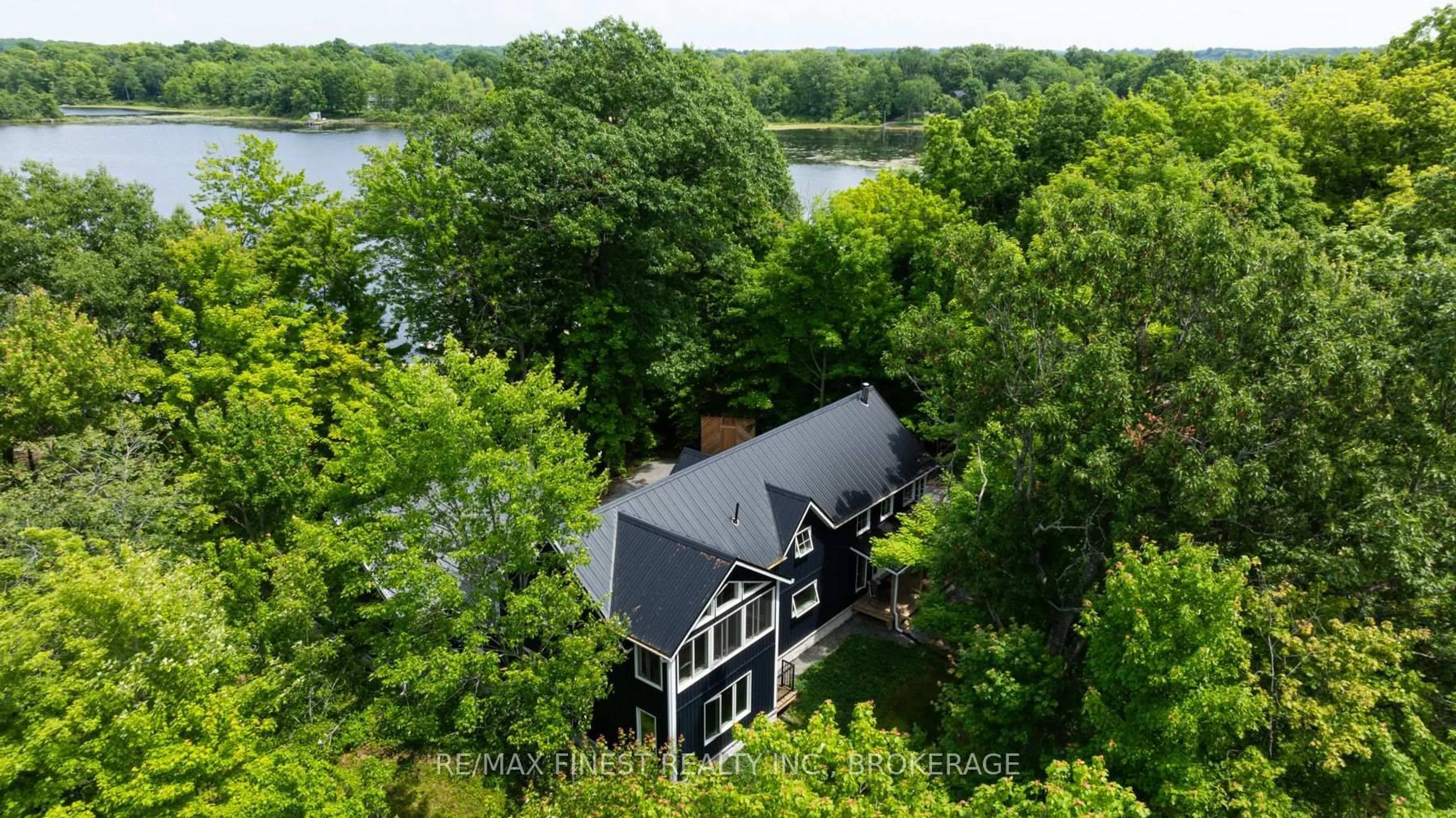 A pic from outside/outdoor area/front of a property/back of a property/a pic from drone, water/lake/river/ocean view for 3855 Hideaway Lane, Battersea Ontario K0H 1H0