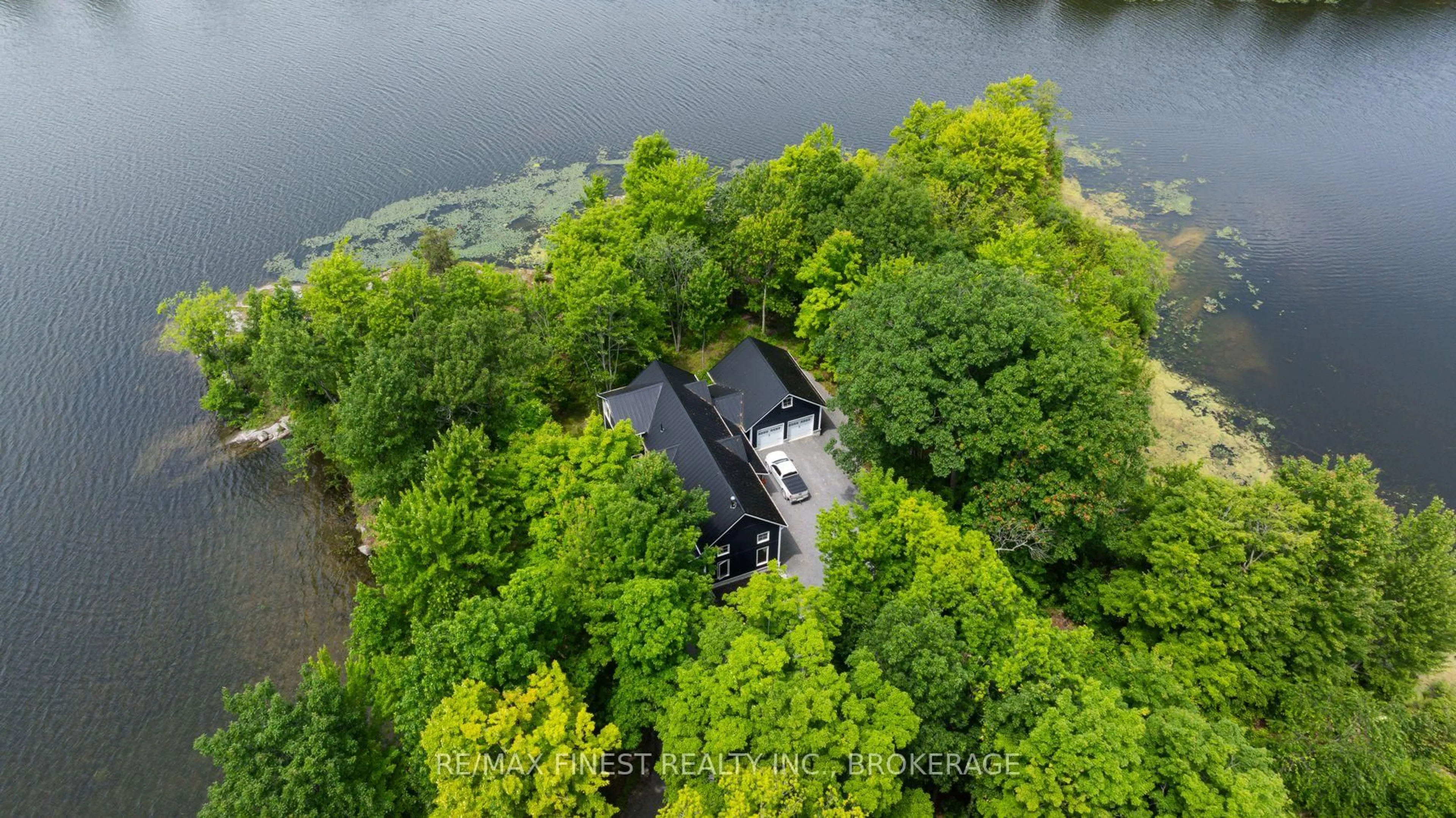 A pic from outside/outdoor area/front of a property/back of a property/a pic from drone, water/lake/river/ocean view for 3855 Hideaway Lane, Battersea Ontario K0H 1H0