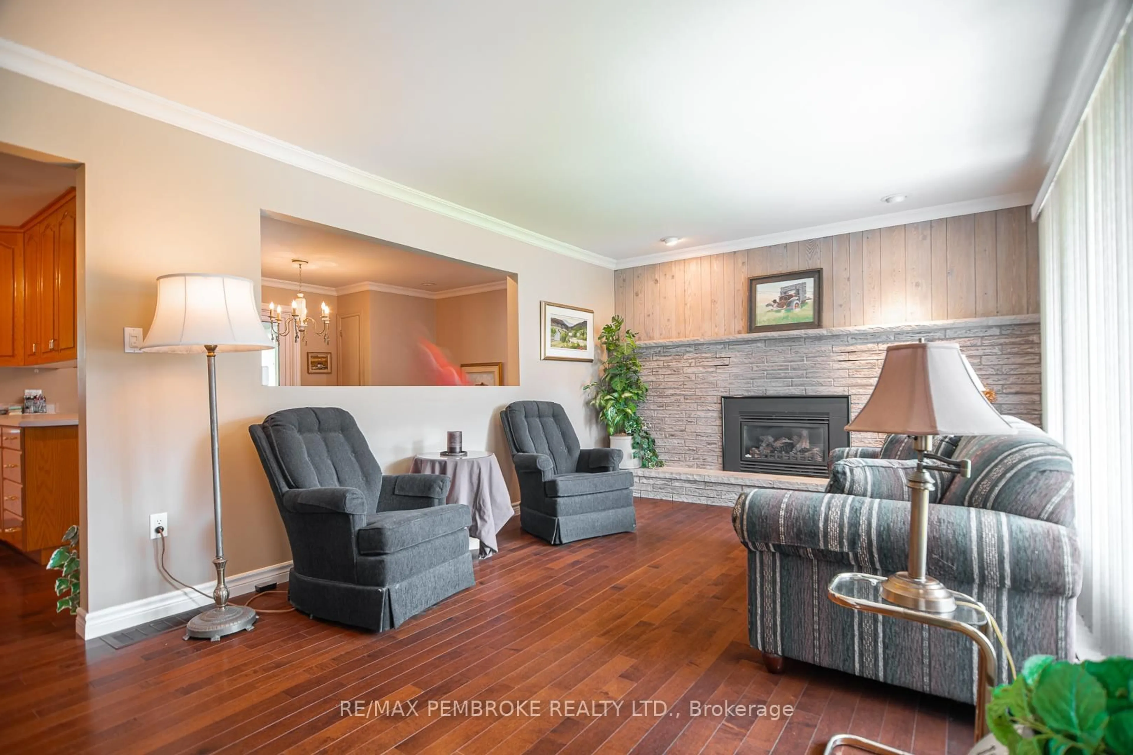 Living room with furniture, wood/laminate floor for 186 Drive-In Rd, Pembroke Ontario K8A 7P4