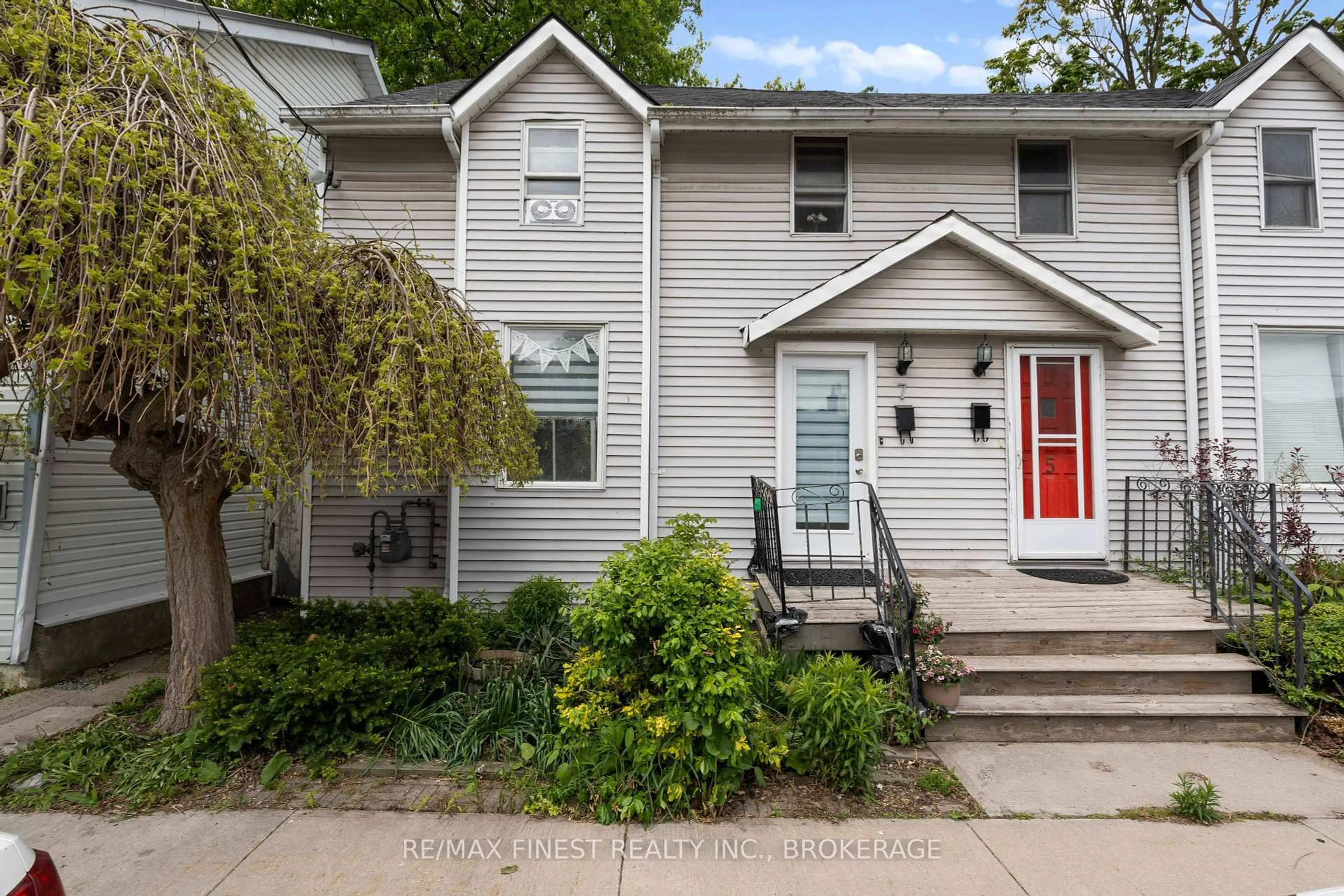 Home with vinyl exterior material, street for 7 Markland St, Kingston Ontario K7K 1S2