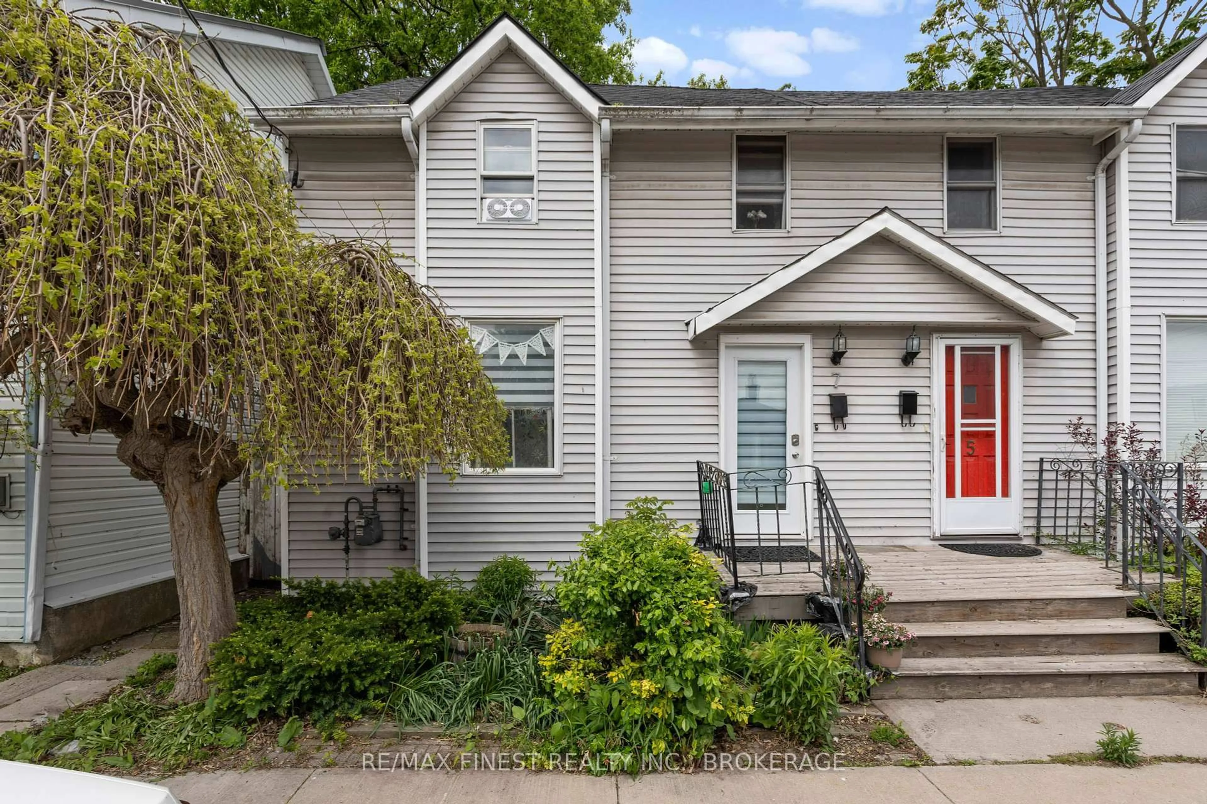 Home with vinyl exterior material, street for 7 Markland St, Kingston Ontario K7K 1S2