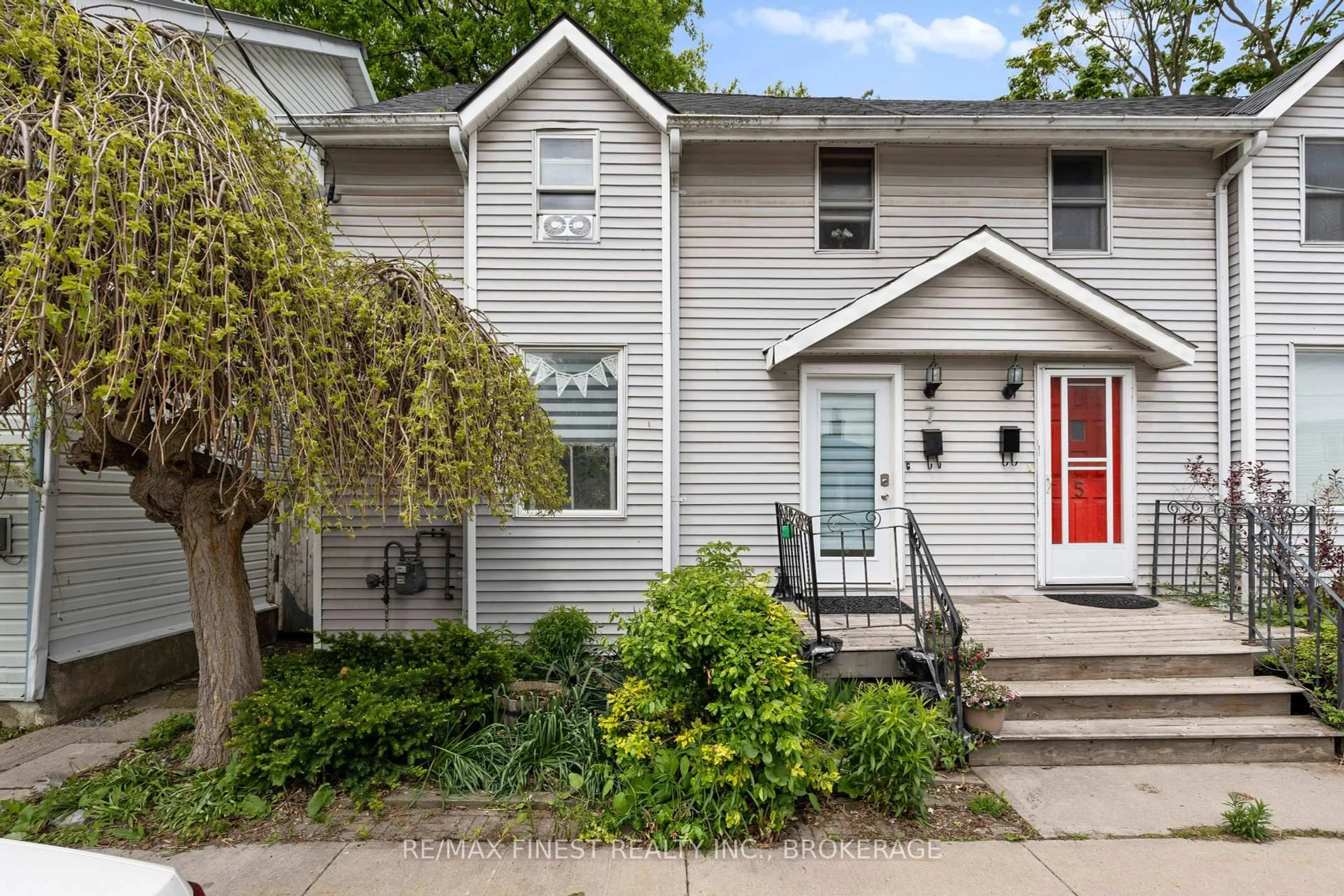 Home with vinyl exterior material, street for 7 Markland St, Kingston Ontario K7K 1S2