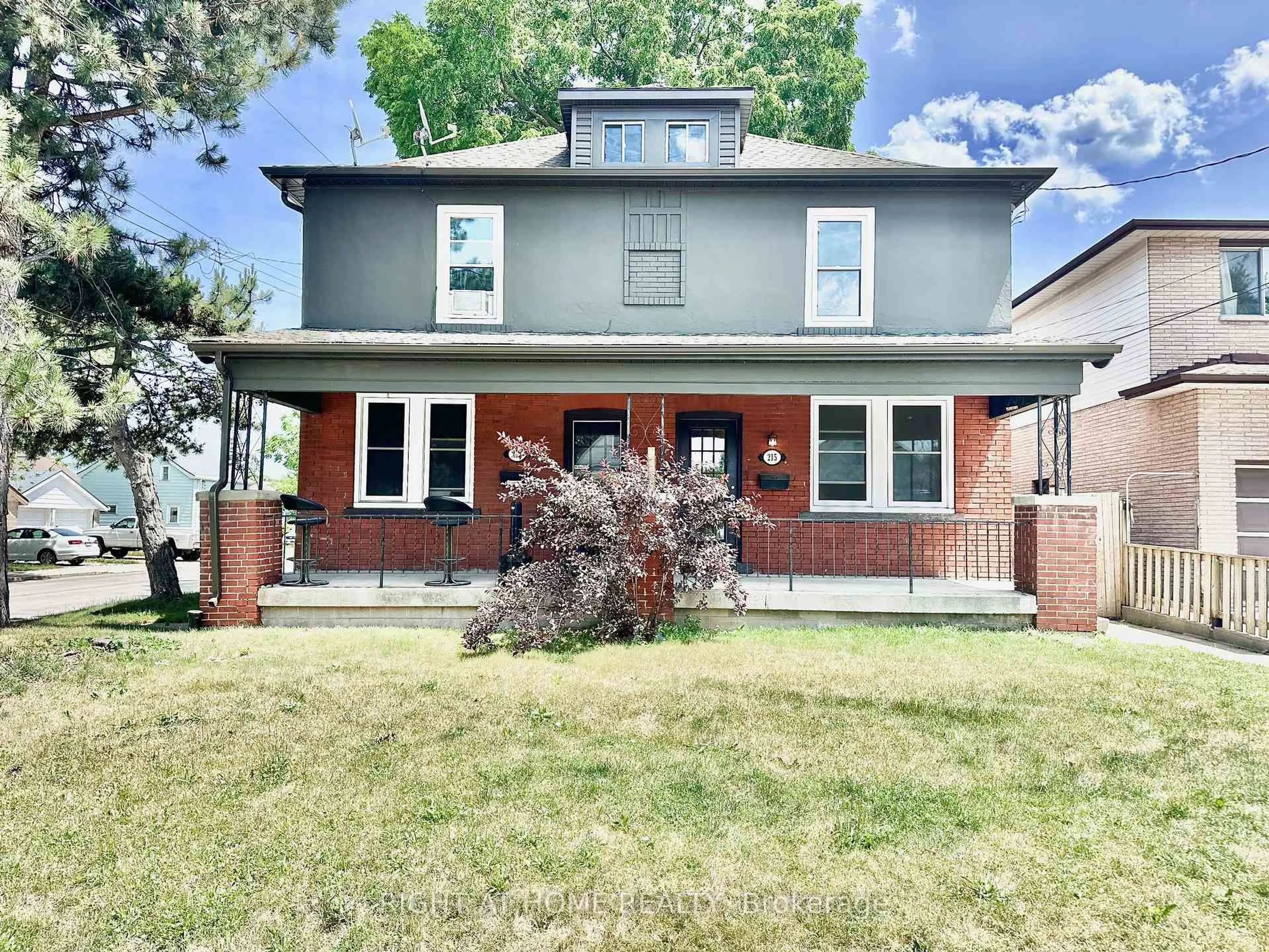 Home with brick exterior material, street for 215 Rosewood Rd, Hamilton Ontario L8K 3J5