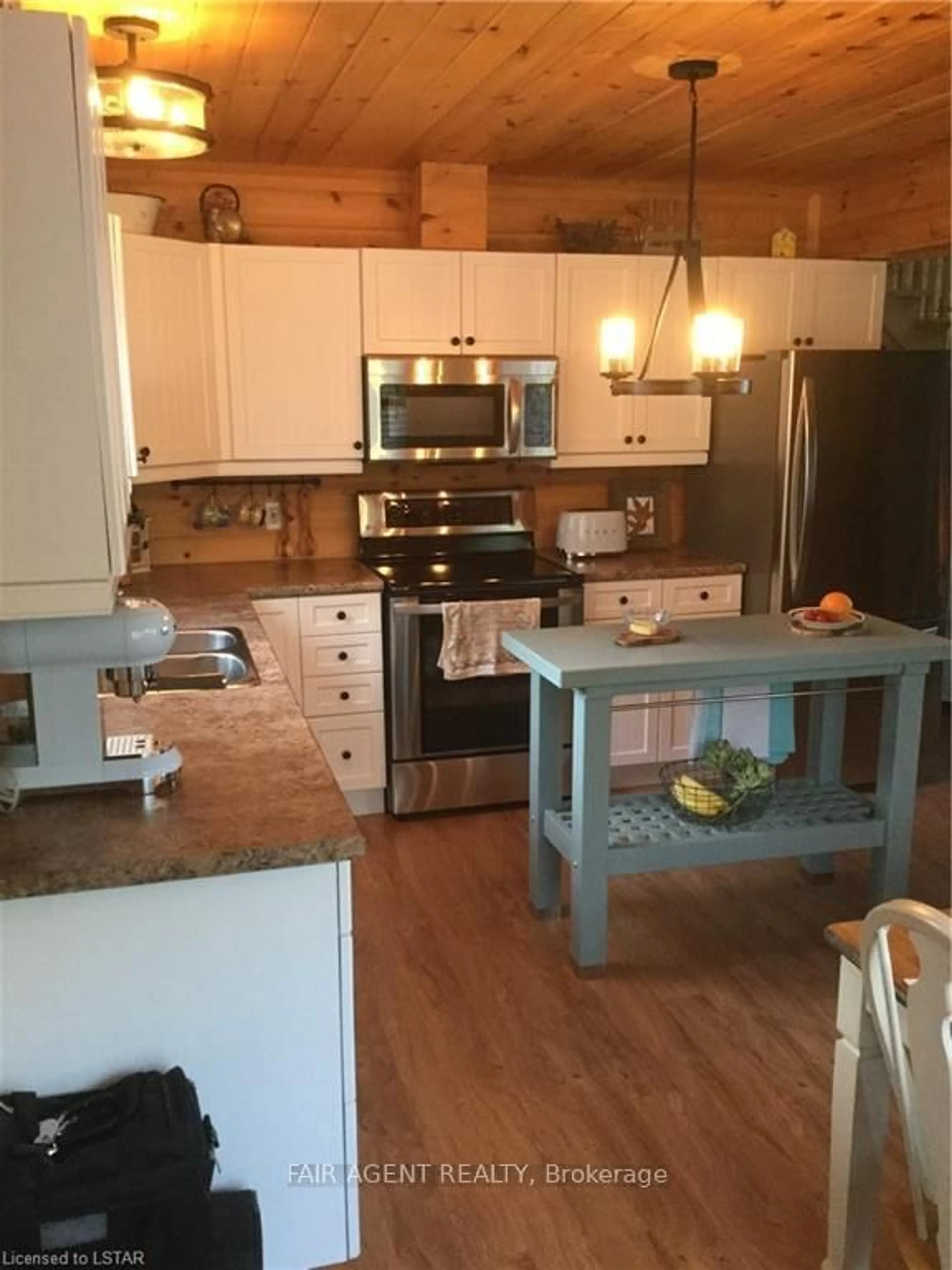Open concept kitchen, wood/laminate floor for 1165B KIRK KOVE Rd, Arden Ontario K0H 1B0