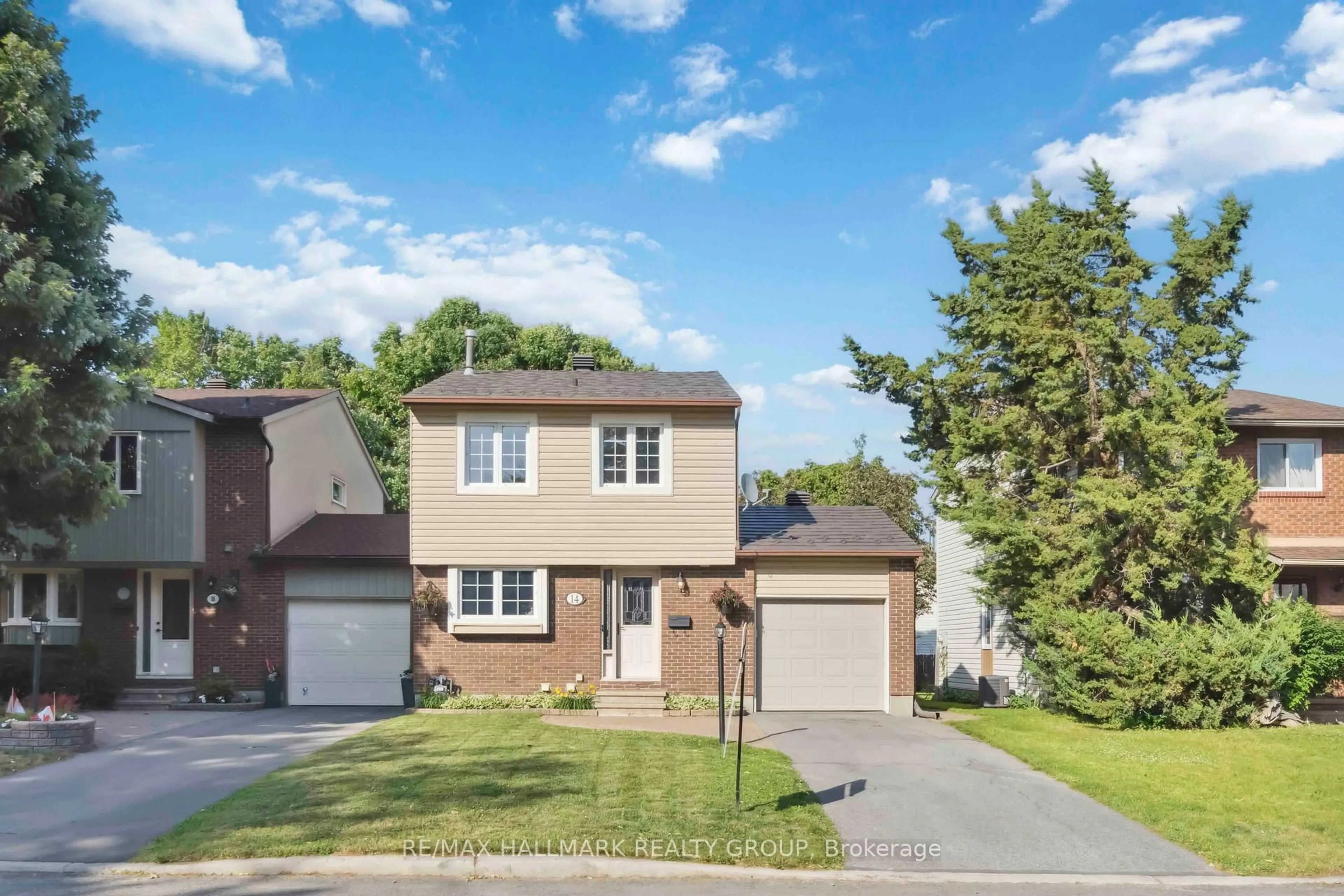 Home with vinyl exterior material, street for 14 Whelan Dr, Barrhaven Ontario K2J 2J9