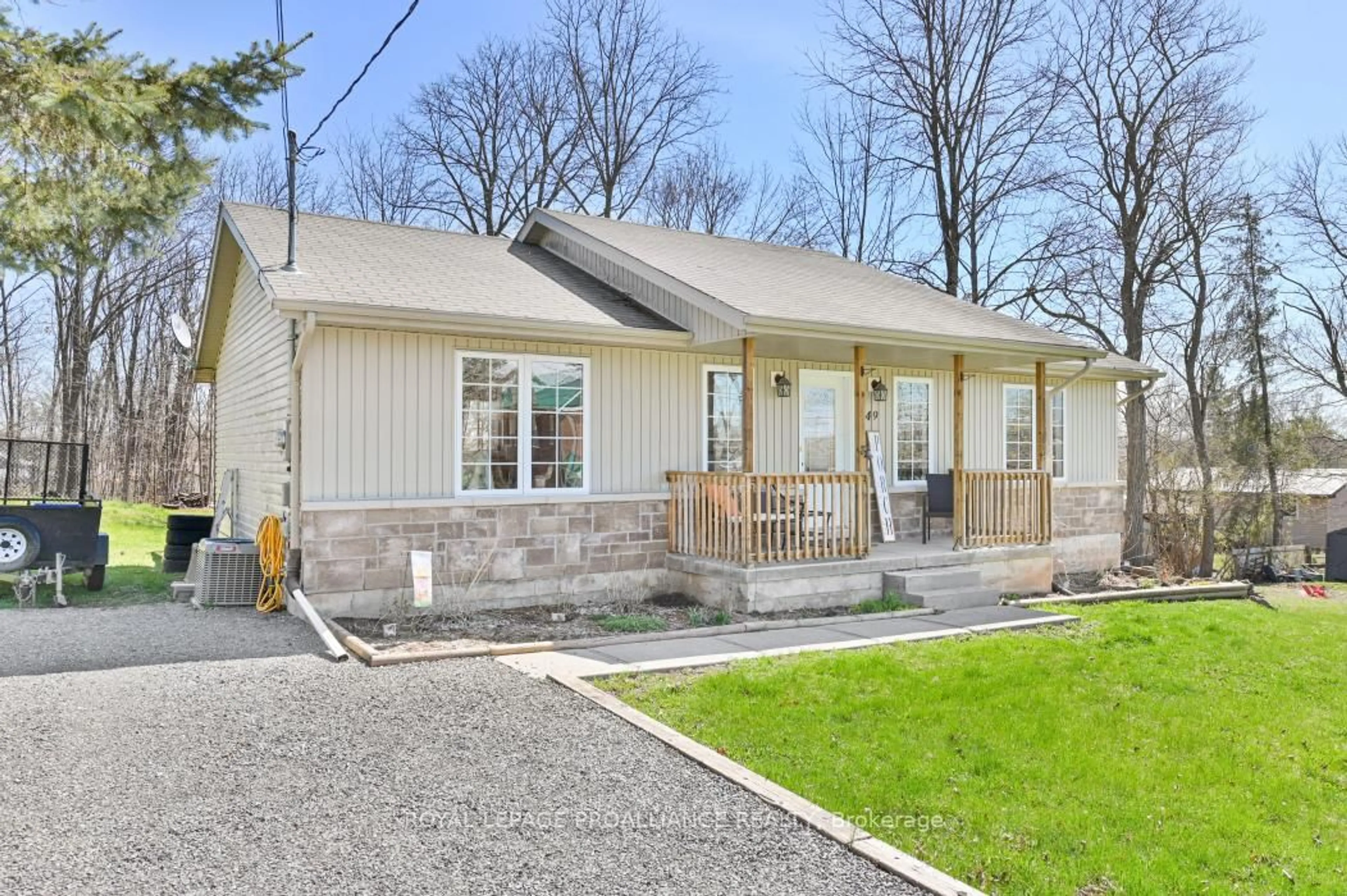 Home with vinyl exterior material, street for 49 Rollins St, Madoc Ontario K0K 2K0