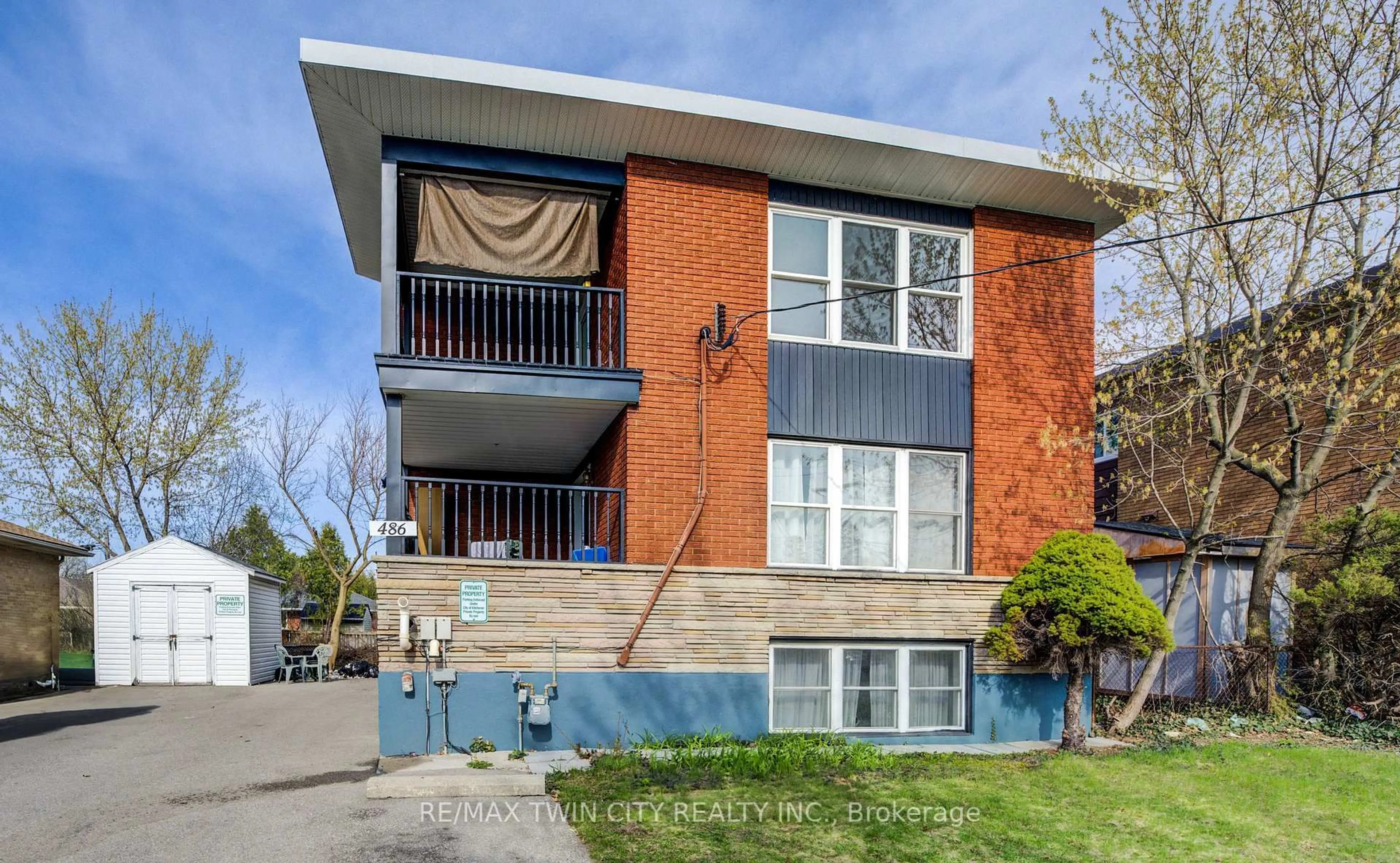 Home with brick exterior material, street for 486 Highland Rd, Kitchener Ontario N2M 3W7