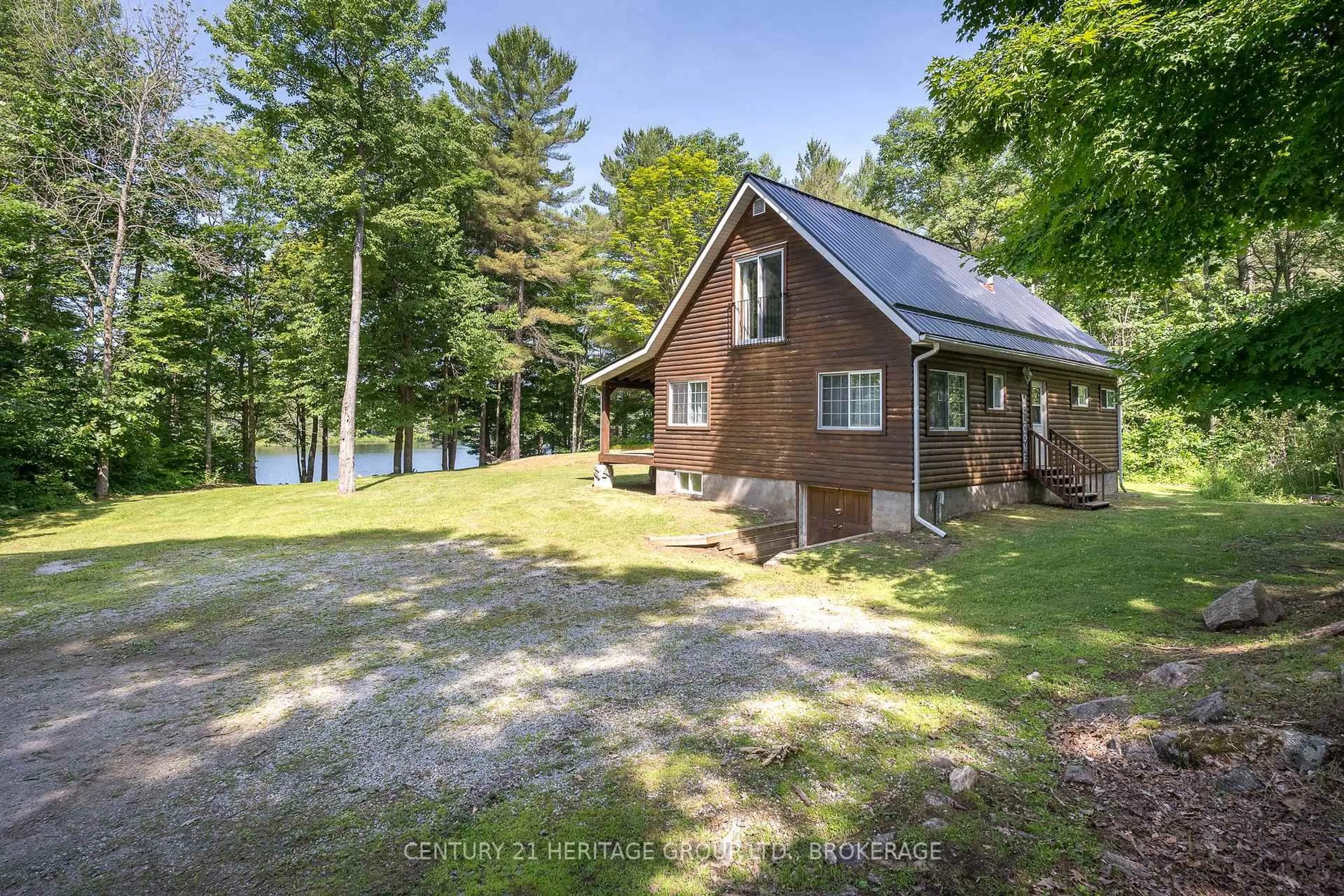 A pic from outside/outdoor area/front of a property/back of a property/a pic from drone, water/lake/river/ocean view for 1147 Ducharme Rd, Sharbot Lake Ontario K0H 2P0