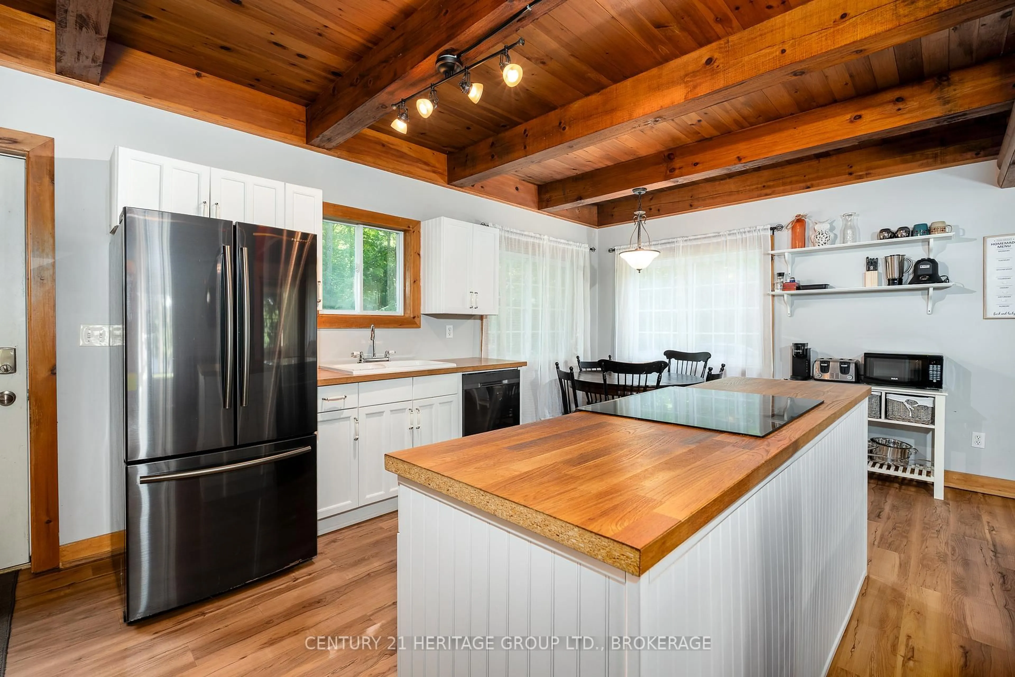 Open concept kitchen, wood/laminate floor for 1147 Ducharme Rd, Sharbot Lake Ontario K0H 2P0