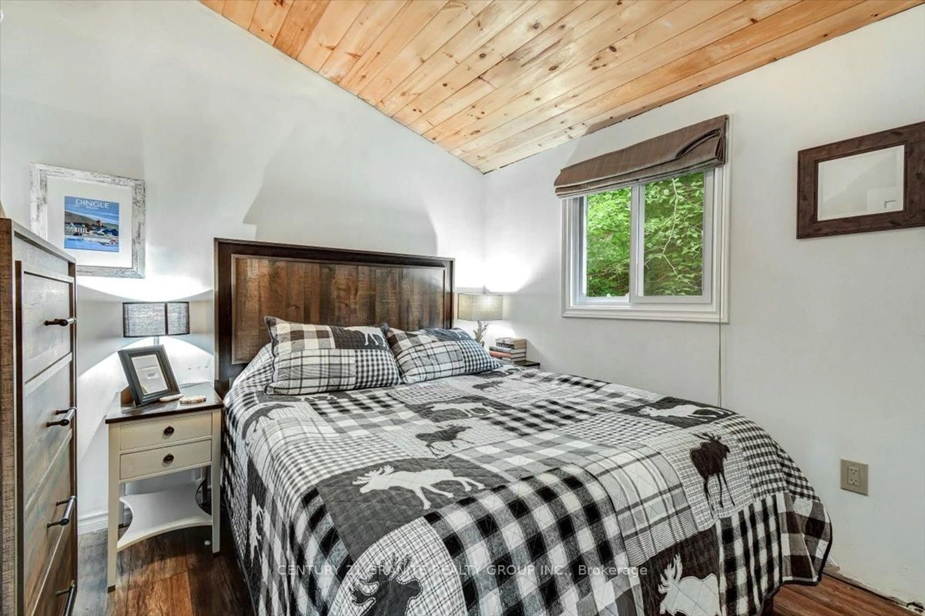 Bedroom with bed, wood/laminate floor for 71 Fire Route 74 B, North Kawartha Ontario K0L 1A0