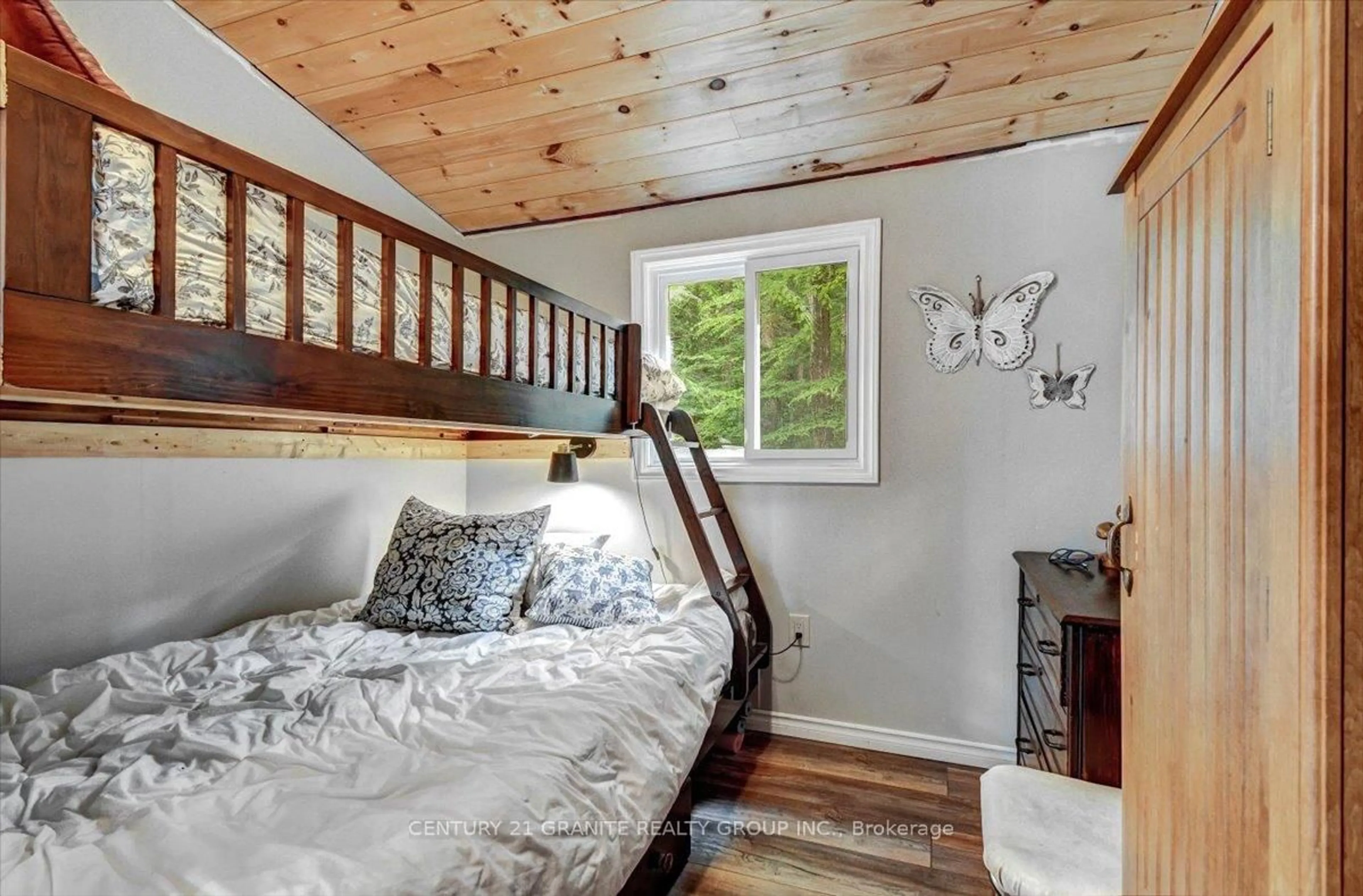Bedroom with bed, wood/laminate floor for 71 Fire Route 74 B, North Kawartha Ontario K0L 1A0
