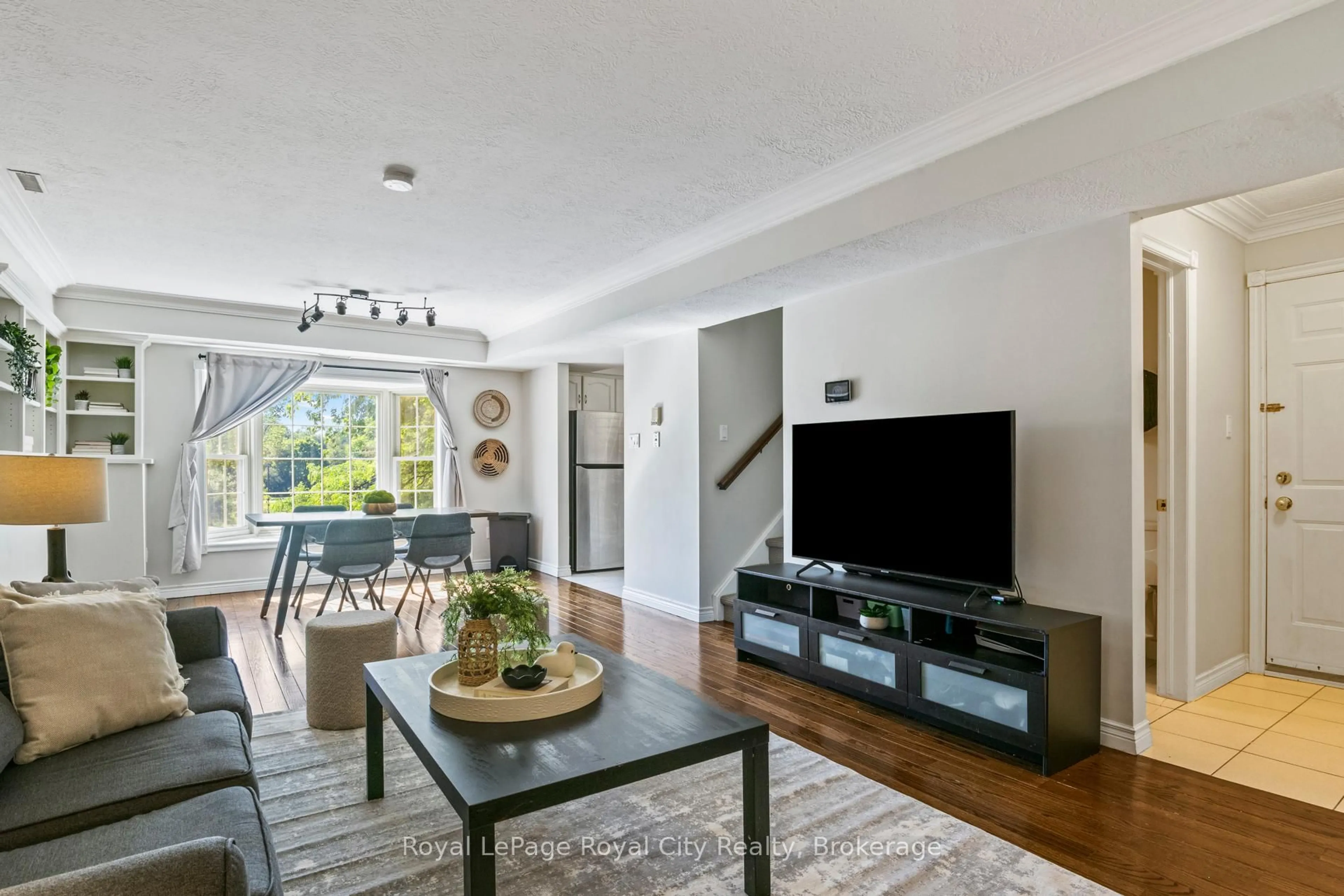 Living room with furniture, wood/laminate floor for 360 Waterloo Ave #209, Guelph Ontario N1H 7Y3