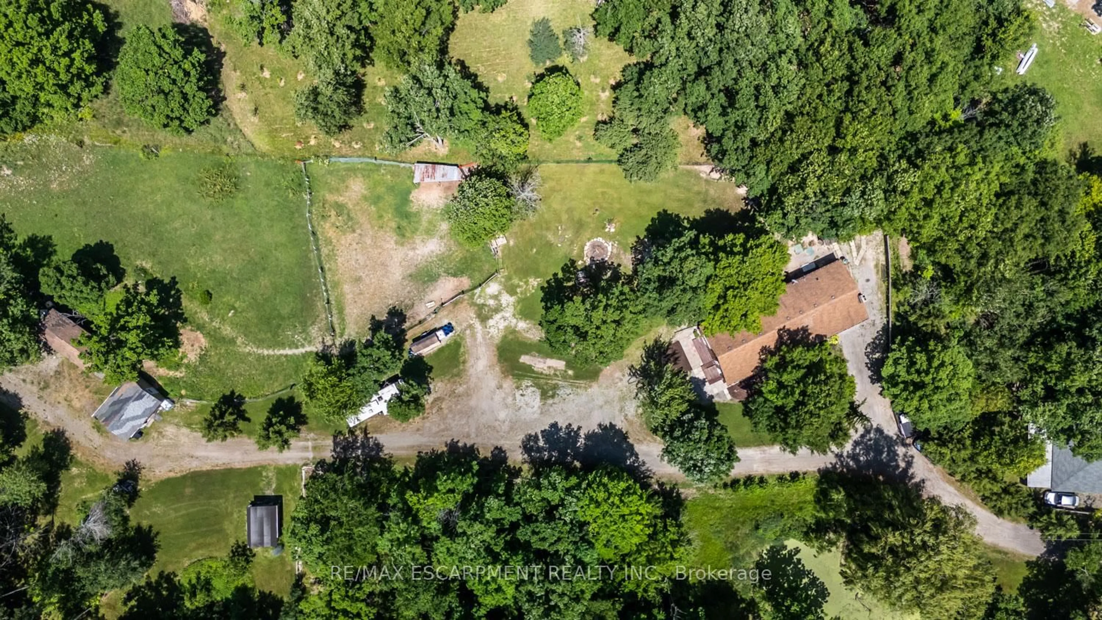 A pic from outside/outdoor area/front of a property/back of a property/a pic from drone, forest/trees view for 1566 Caistorville Rd, West Lincoln Ontario L0R 1E0
