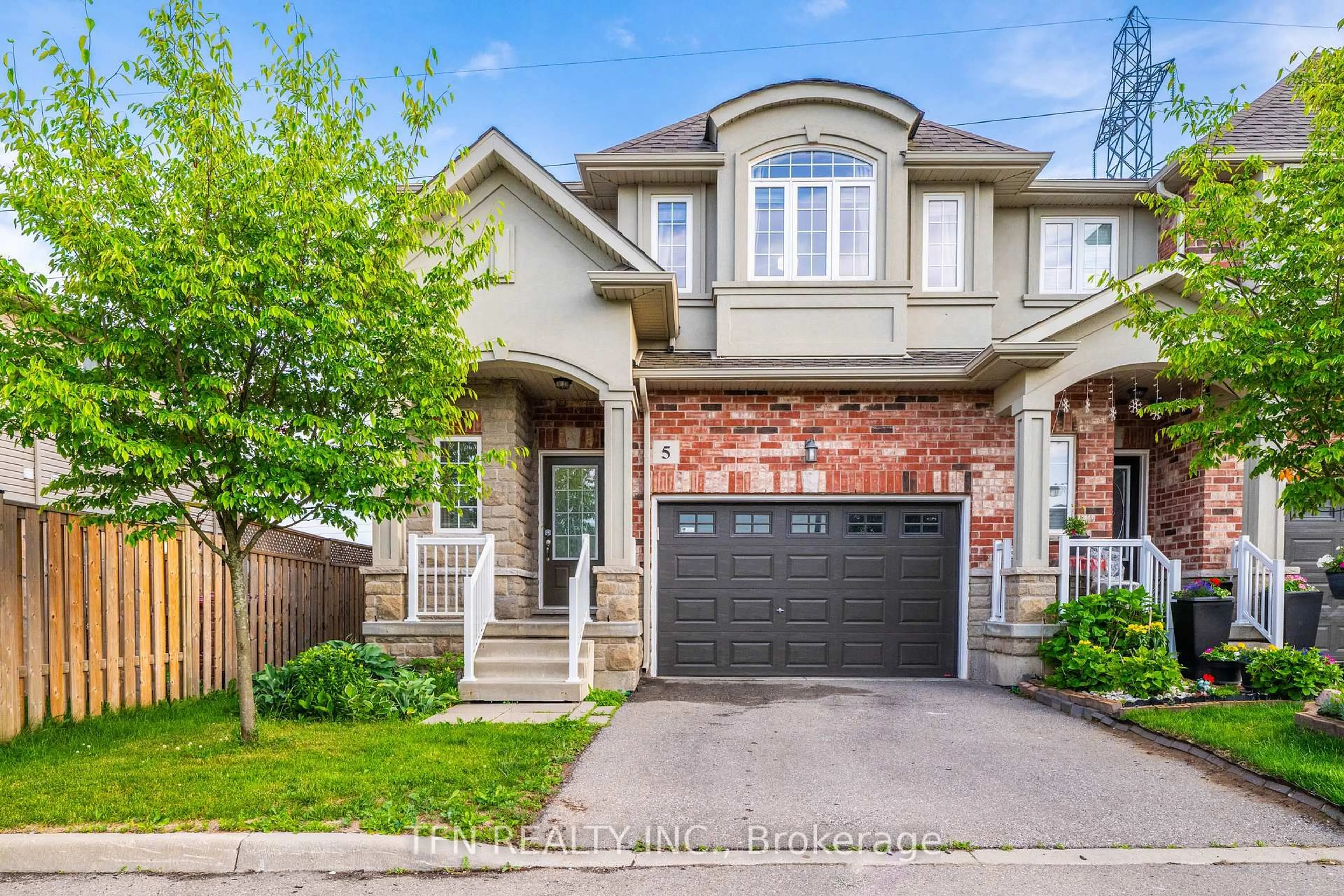 Home with brick exterior material, street for 73 Medici Lane #5, Hamilton Ontario L9B 0H2