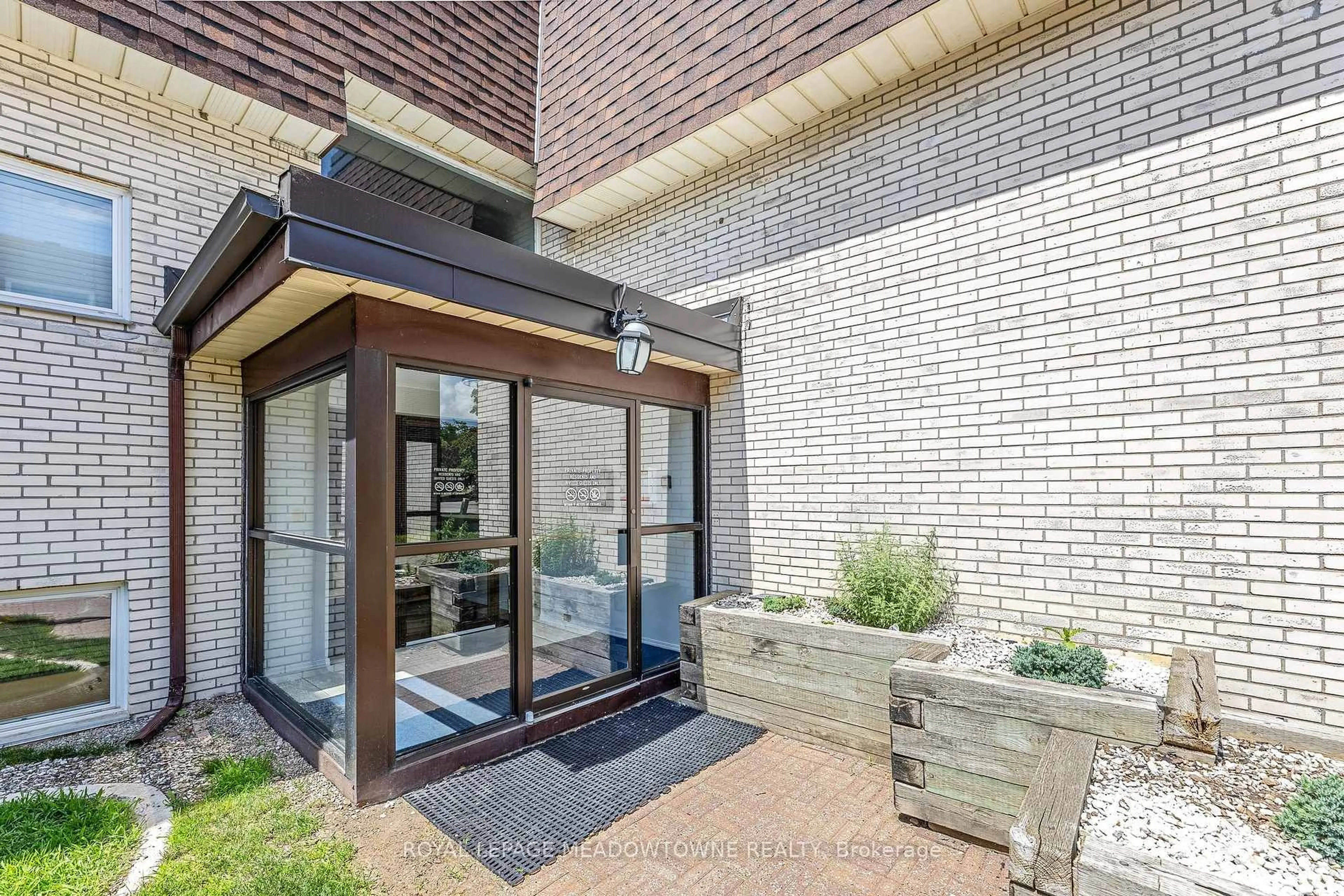 Home with brick exterior material, street for 53 Conroy Cres #203, Guelph Ontario N1G 2V5