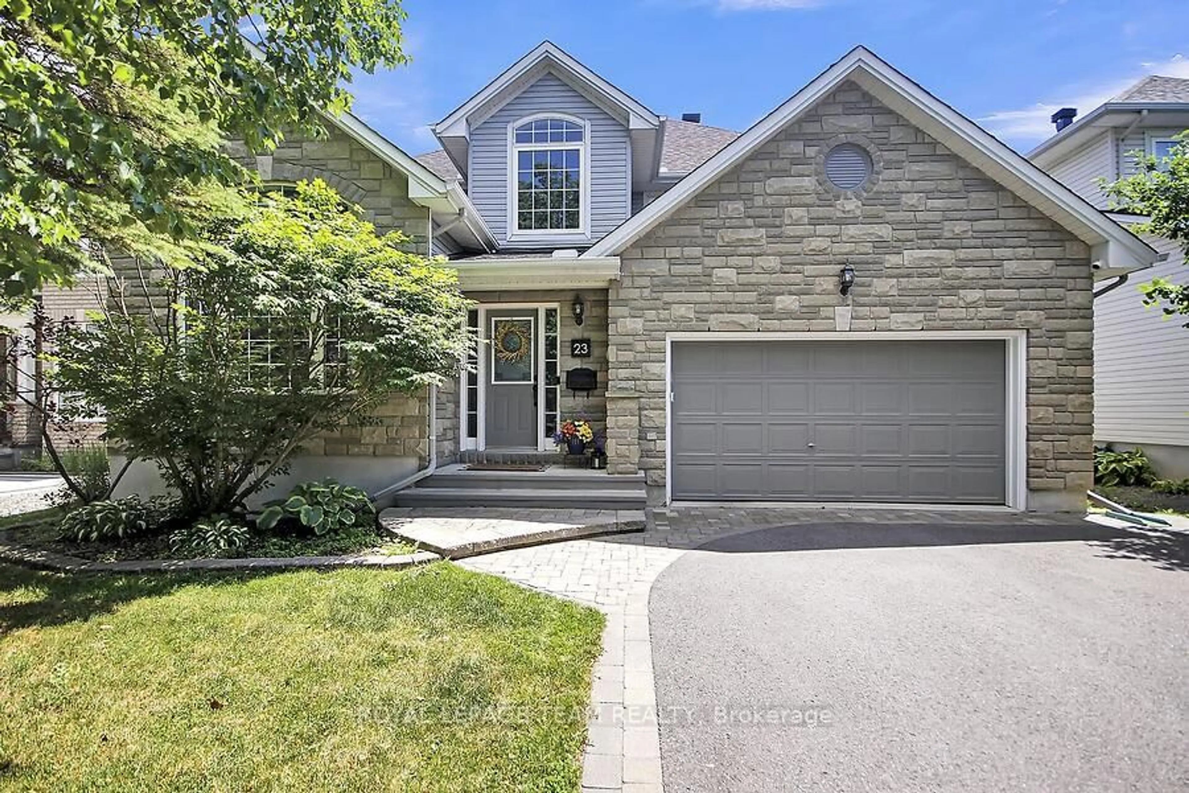 Home with brick exterior material, street for 23 Windgate Cres, Ottawa Ontario K2M 2X1