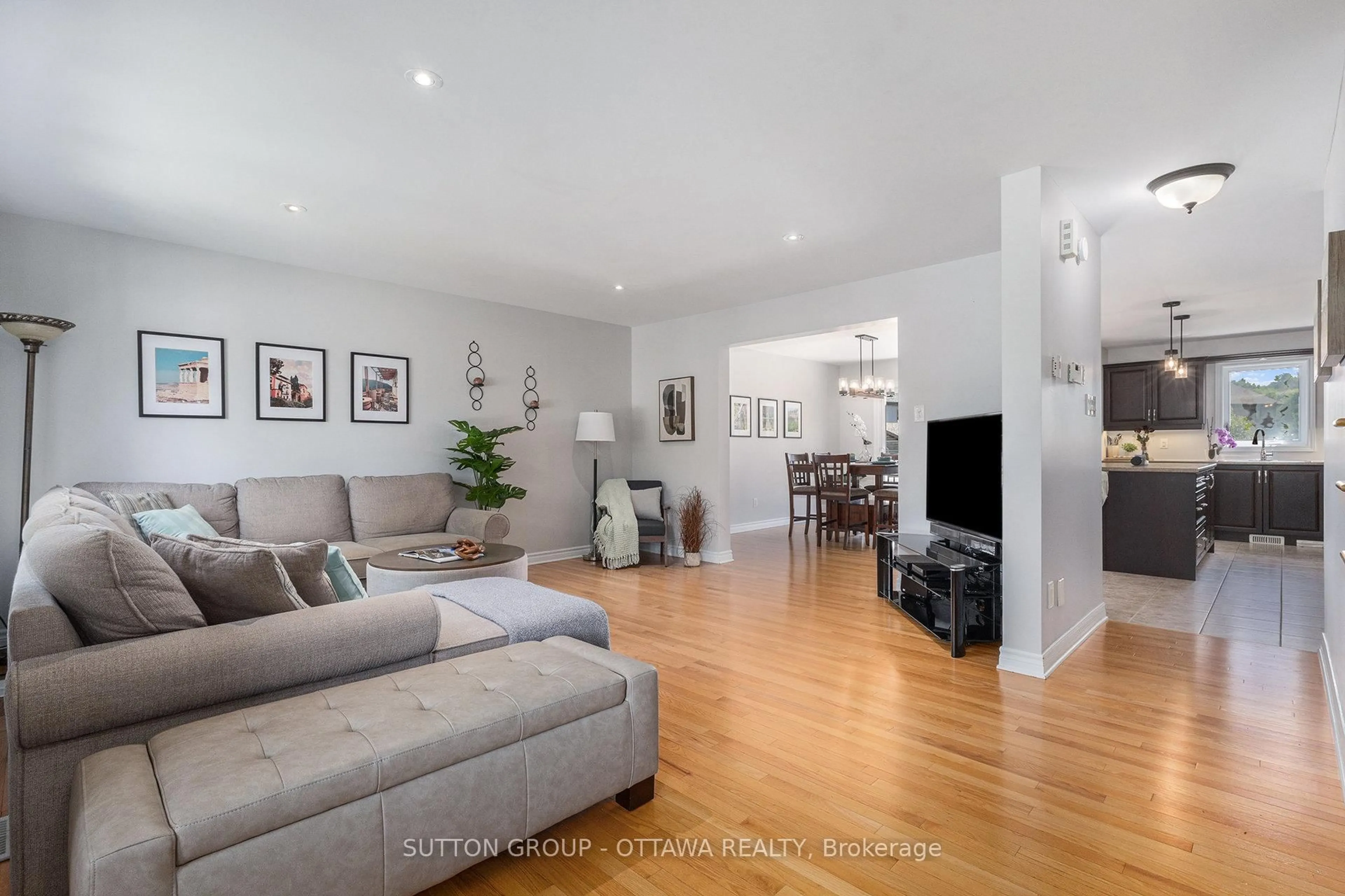 Living room with furniture, wood/laminate floor for 56 Honore Cres, The Nation Ontario K0A 2M0