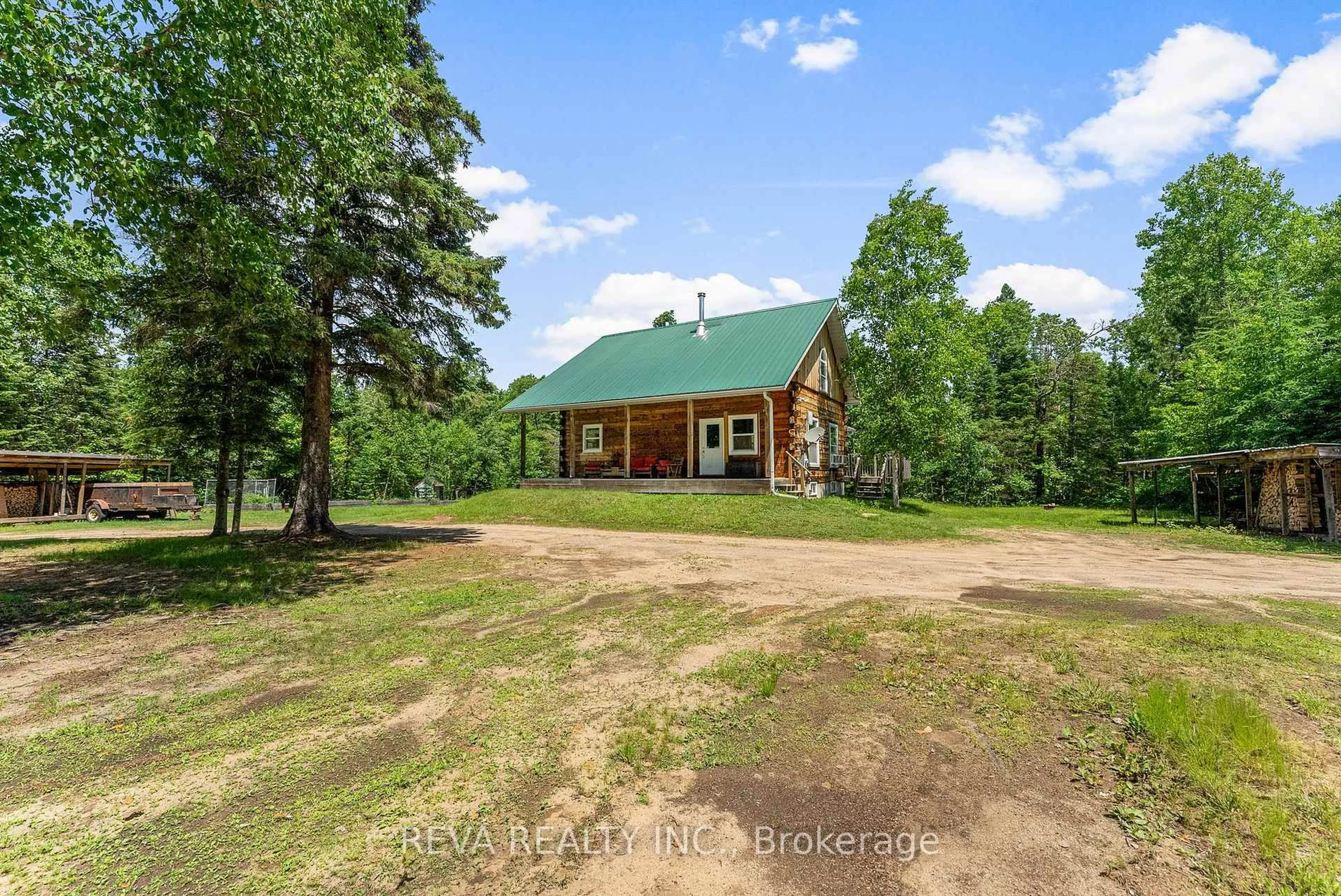 A pic from outside/outdoor area/front of a property/back of a property/a pic from drone, unknown for 21 Lorraine Rd, Maynooth Ontario K0L 2K0