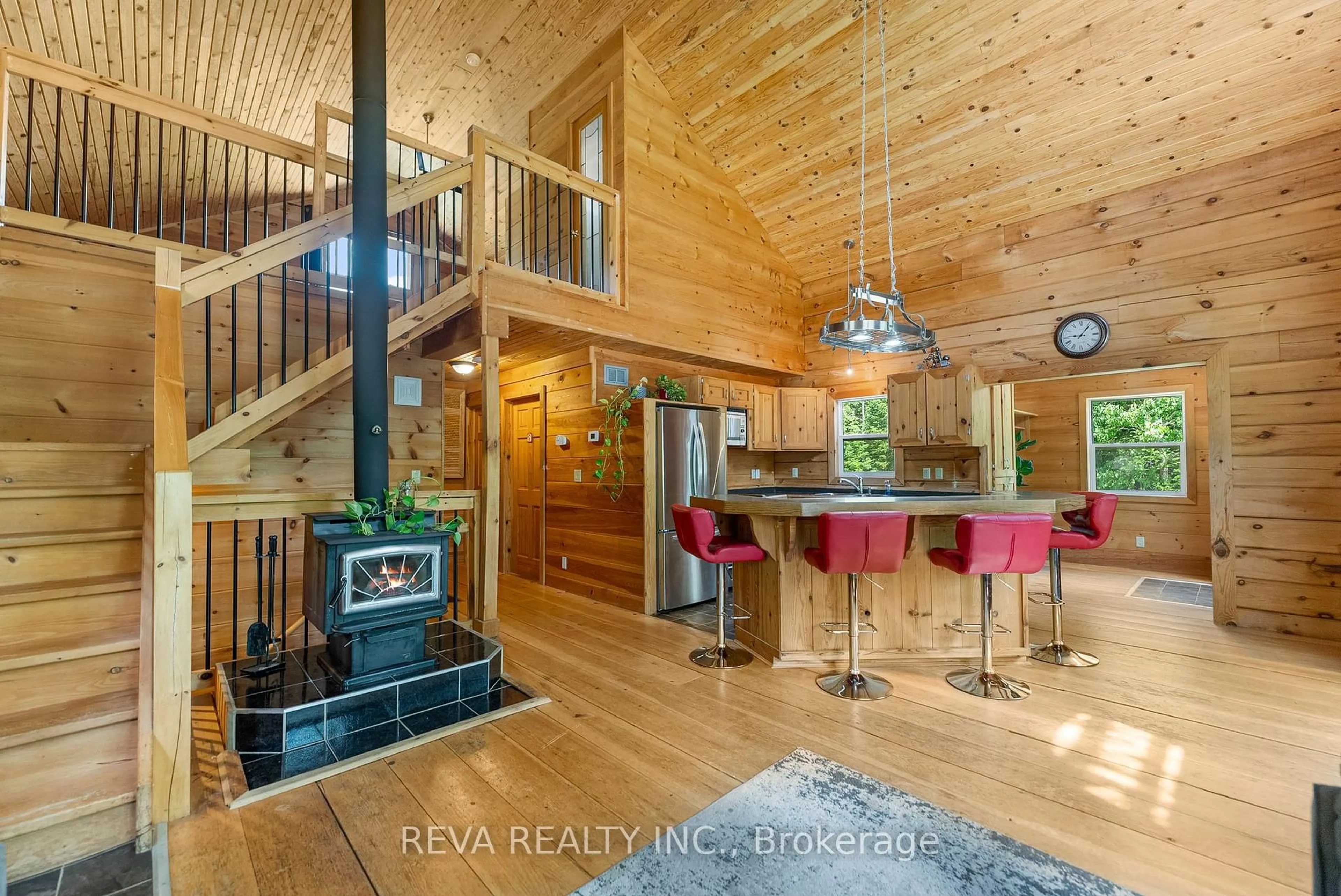 Open concept kitchen, wood/laminate floor for 21 Lorraine Rd, Maynooth Ontario K0L 2K0