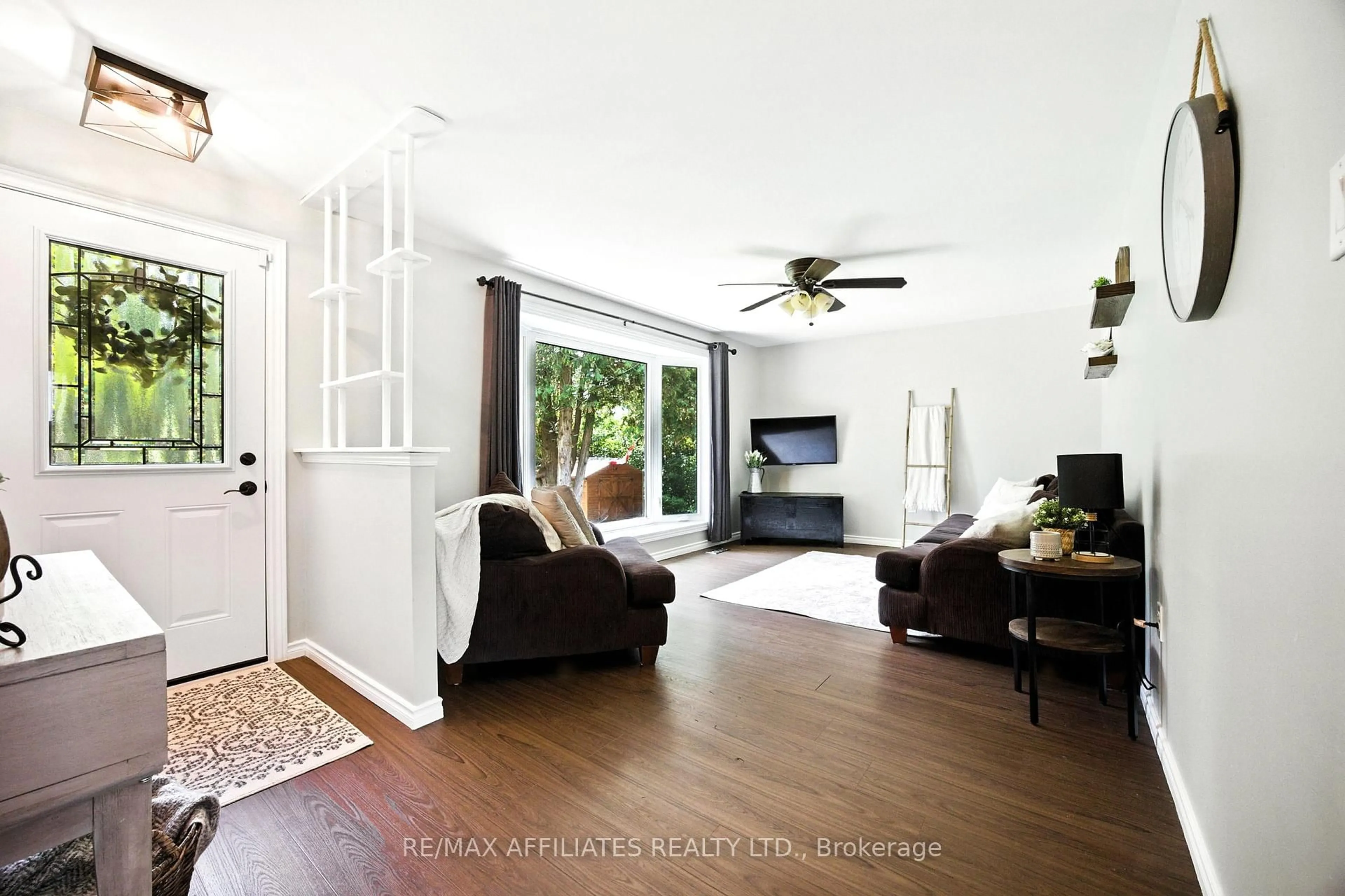 Living room with furniture, wood/laminate floor for 491 Lake Ave, Carleton Place Ontario K7C 3S7