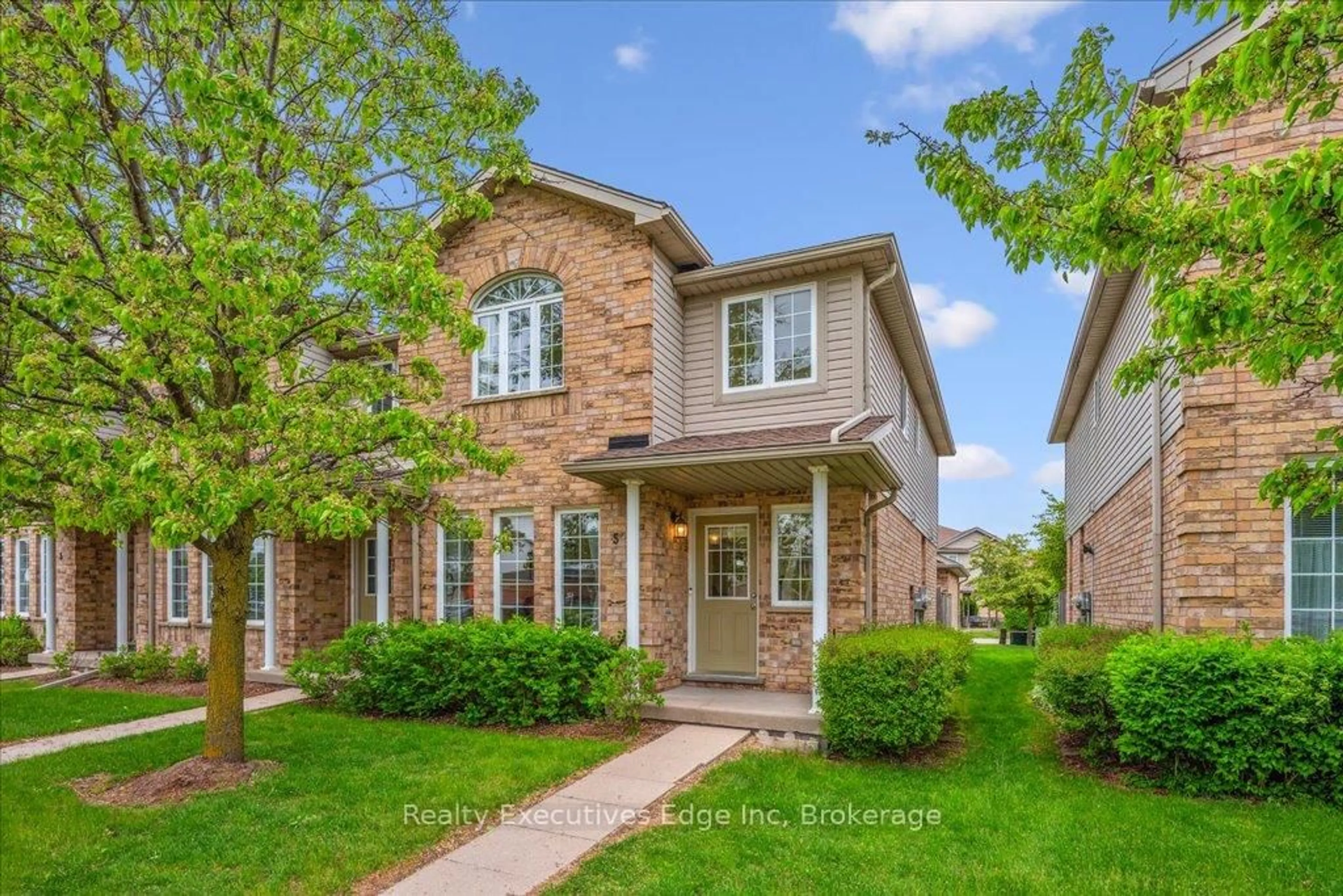 Home with brick exterior material, street for 210 Dawn Ave #5, Guelph Ontario N1G 5L5