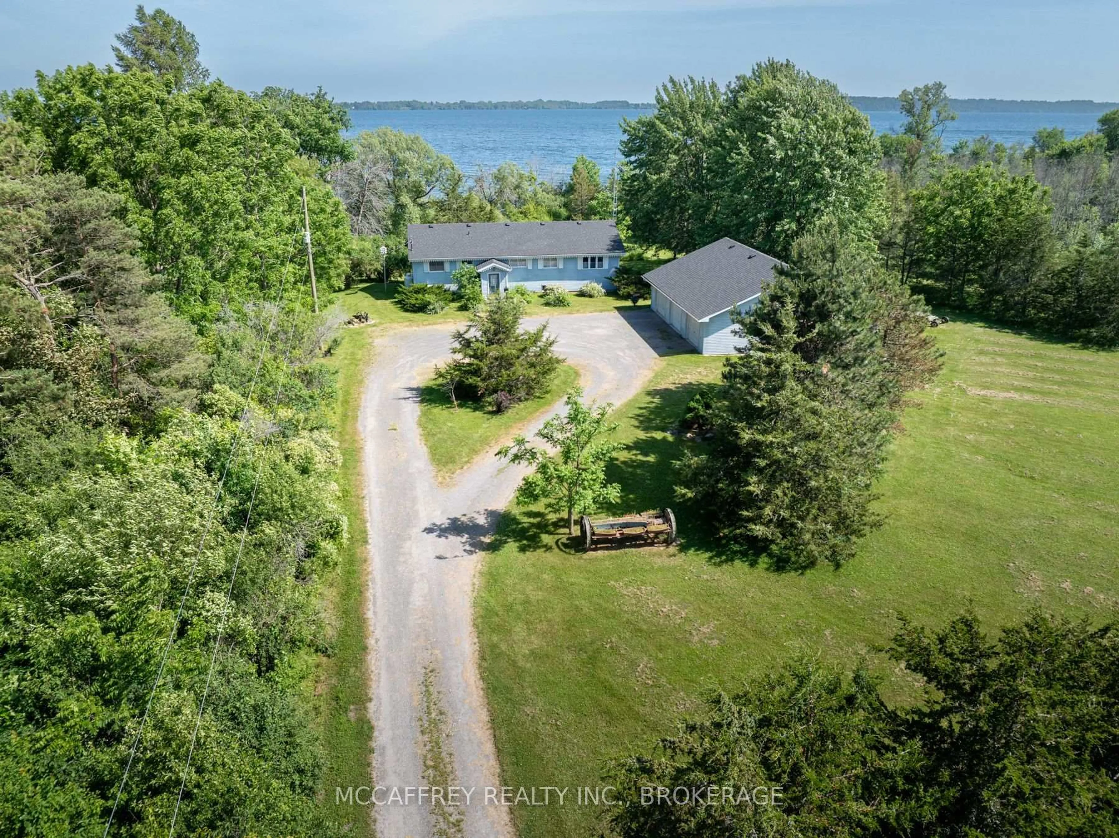 A pic from outside/outdoor area/front of a property/back of a property/a pic from drone, water/lake/river/ocean view for 8742 Highway 33, Bath Ontario K0H 1G0