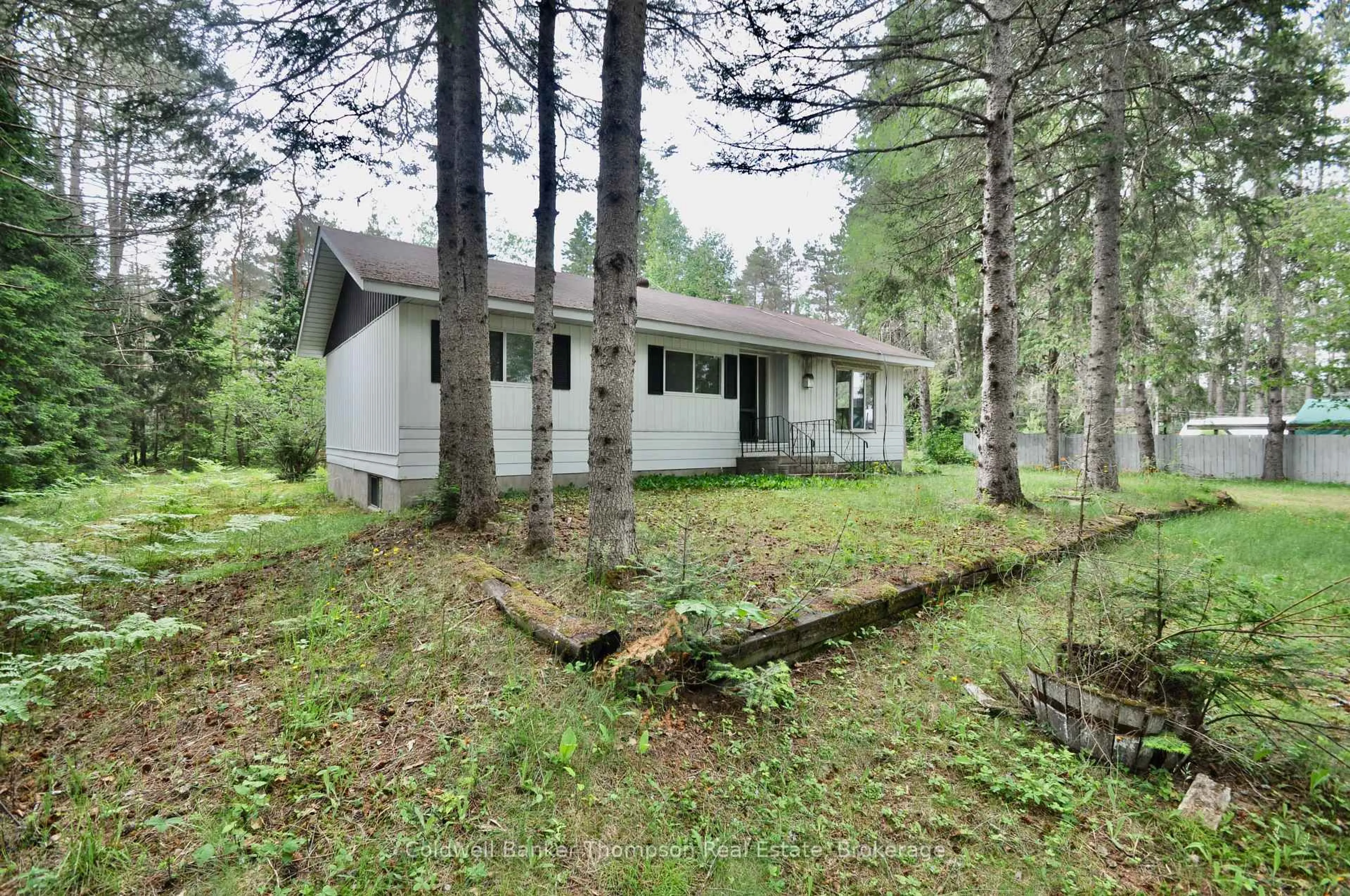 A pic from outside/outdoor area/front of a property/back of a property/a pic from drone, forest/trees view for 8 Spruce Lane, Armour Ontario P0A 1L0
