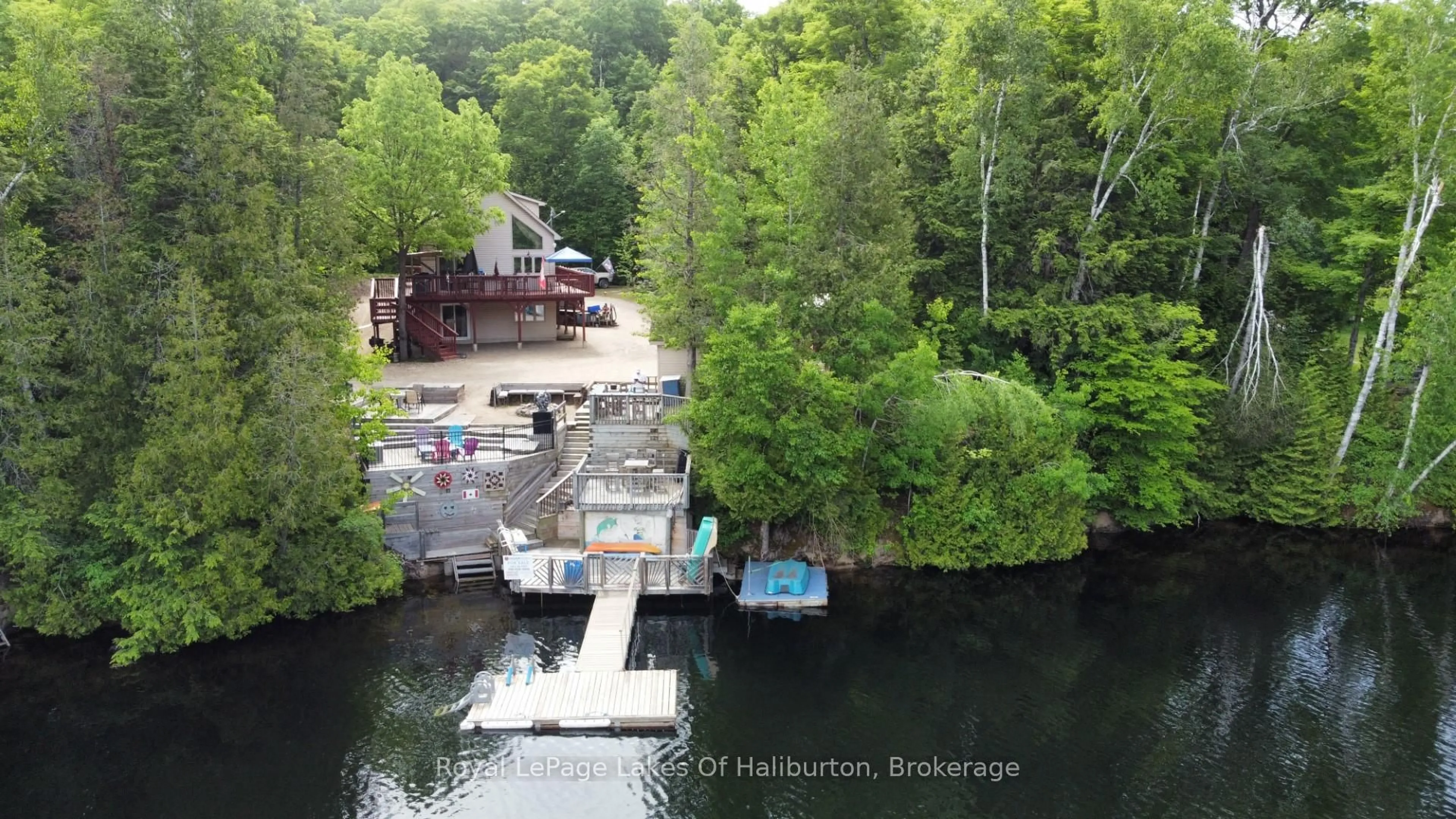 A pic from outside/outdoor area/front of a property/back of a property/a pic from drone, water/lake/river/ocean view for 1701 Claude Brown Rd, Minden Hills Ontario K0M 2K0
