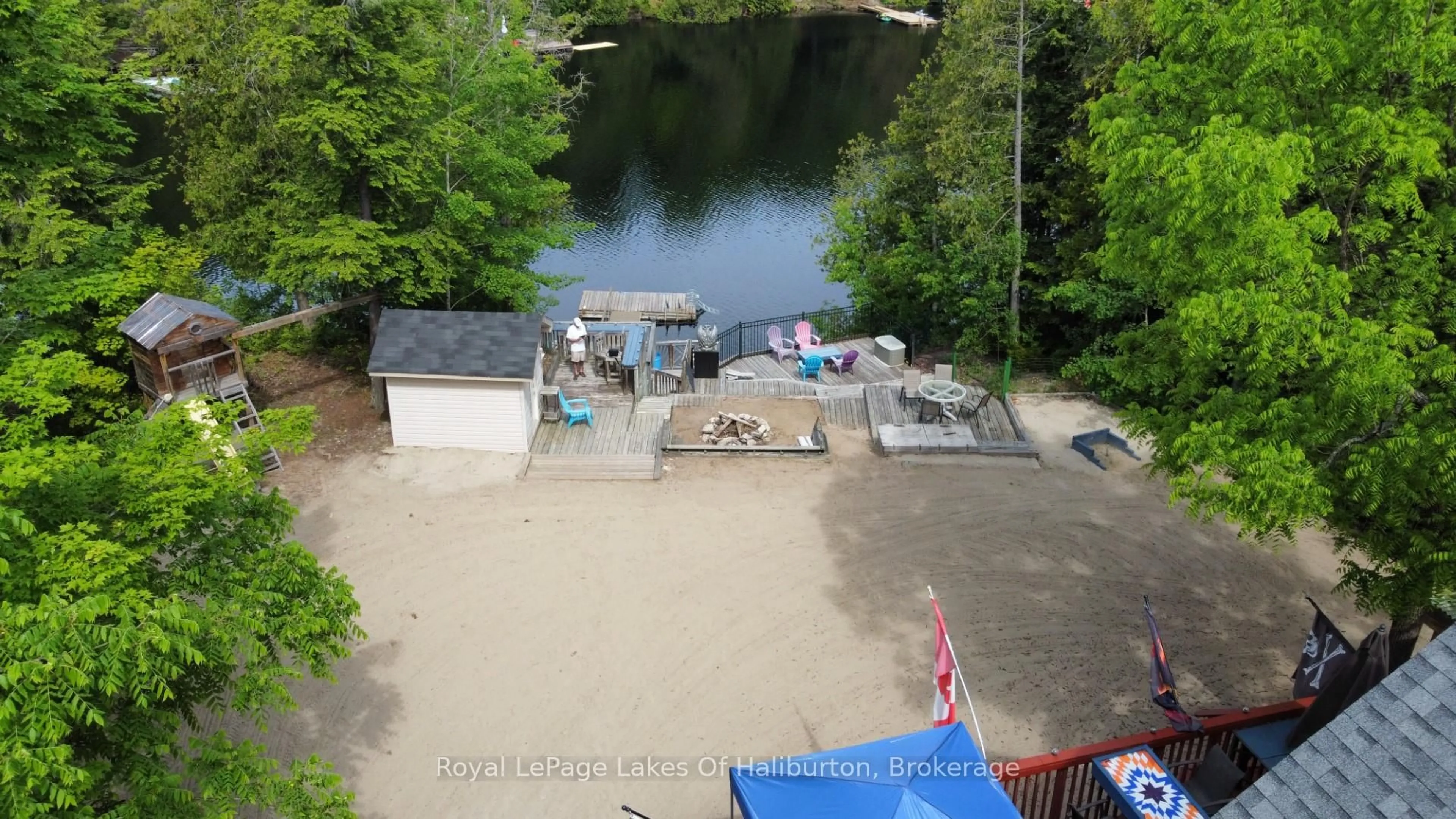 A pic from outside/outdoor area/front of a property/back of a property/a pic from drone, water/lake/river/ocean view for 1701 Claude Brown Rd, Minden Hills Ontario K0M 2K0