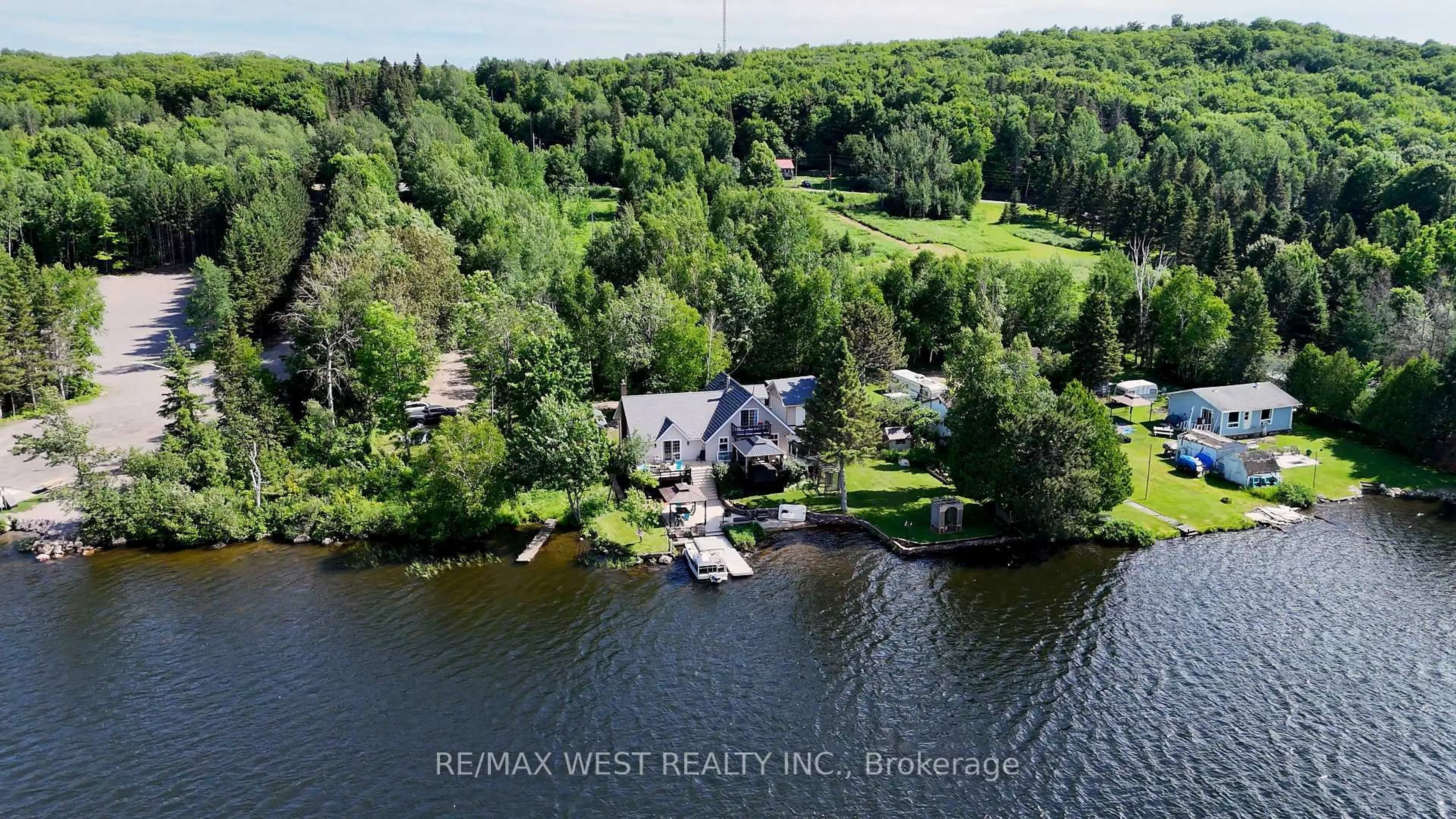 A pic from outside/outdoor area/front of a property/back of a property/a pic from drone, water/lake/river/ocean view for 38 Turgeon Lane, East Ferris Ontario P0H 1B0