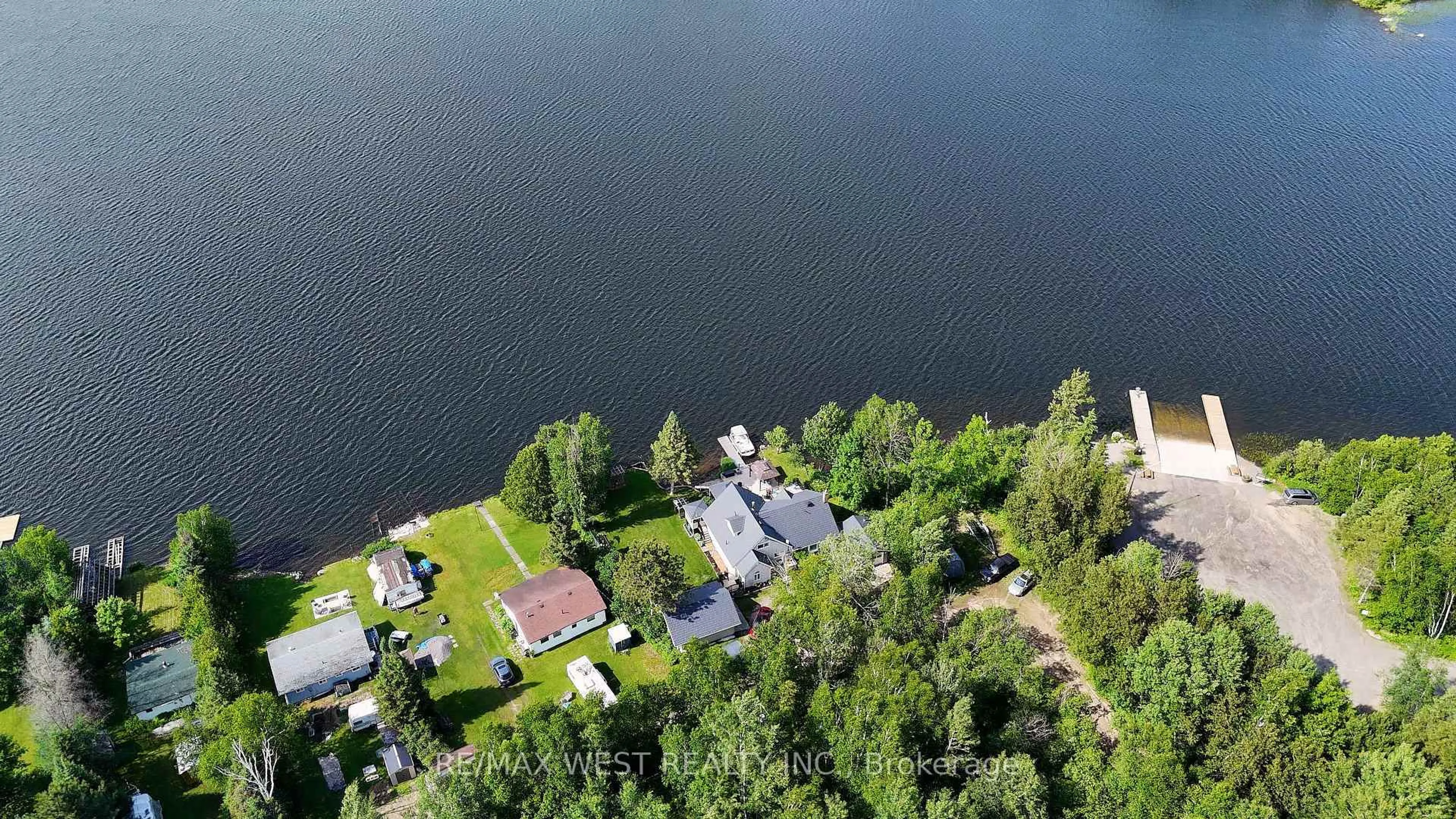 A pic from outside/outdoor area/front of a property/back of a property/a pic from drone, water/lake/river/ocean view for 38 Turgeon Lane, East Ferris Ontario P0H 1B0