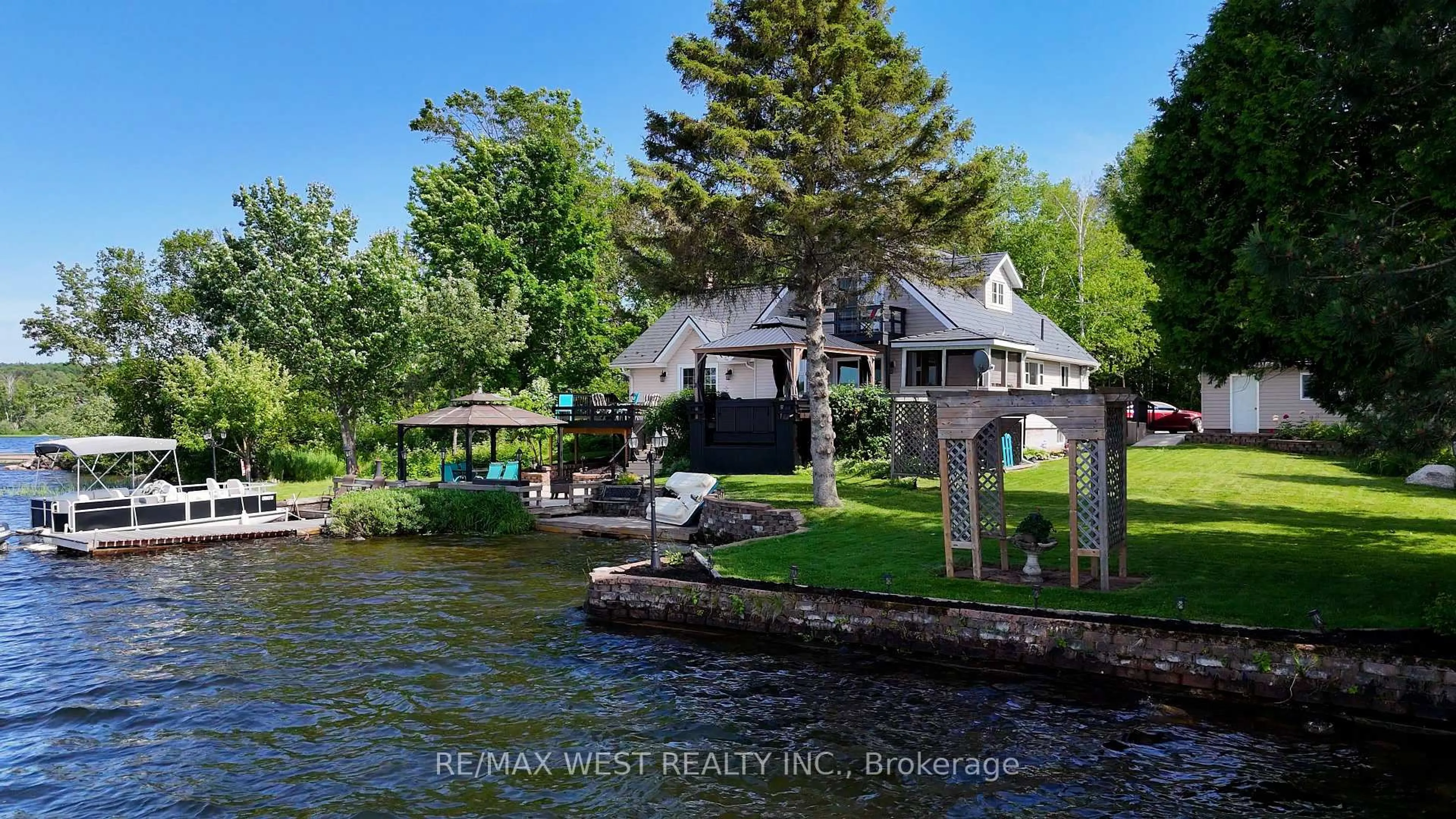 A pic from outside/outdoor area/front of a property/back of a property/a pic from drone, water/lake/river/ocean view for 38 Turgeon Lane, East Ferris Ontario P0H 1B0