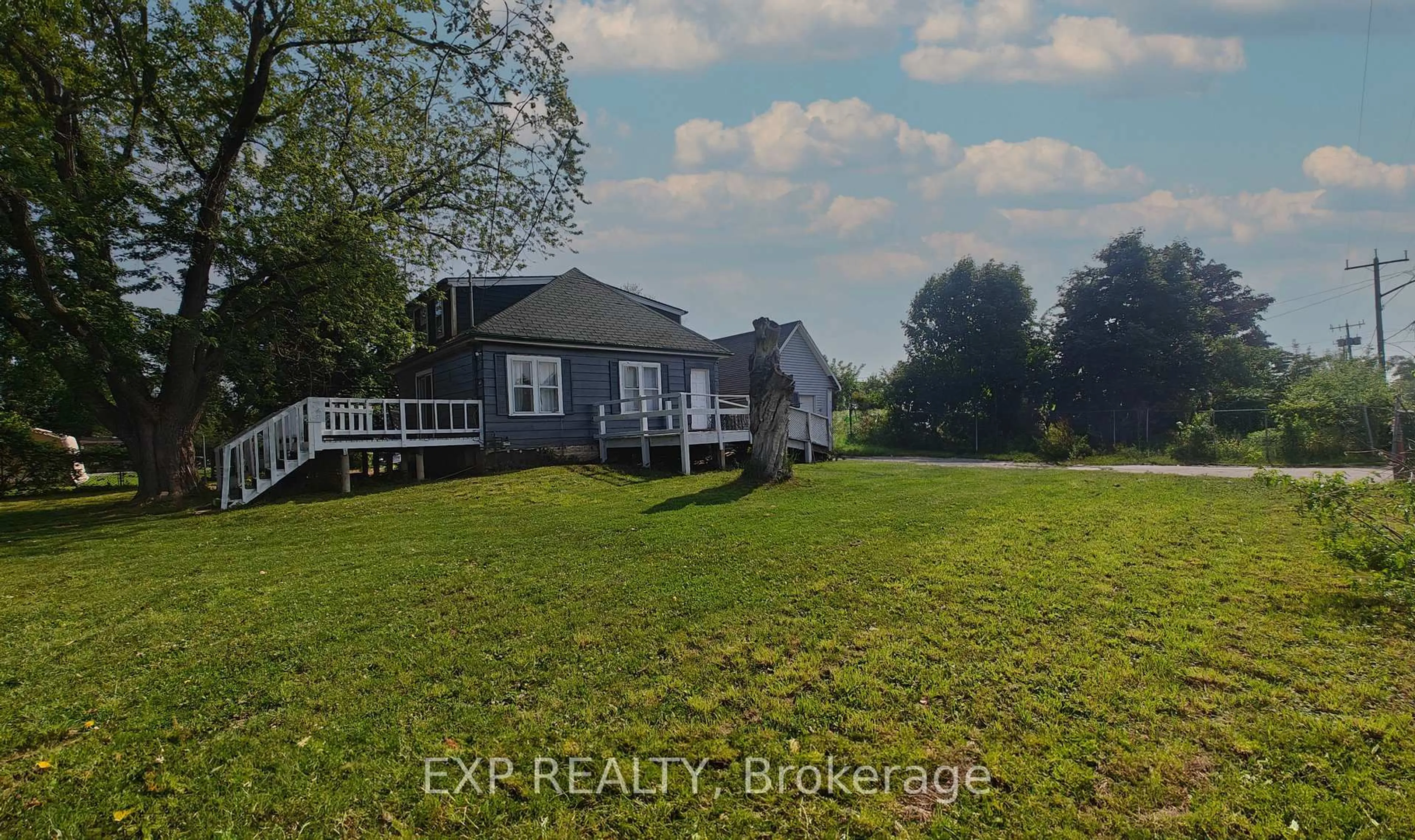 A pic from outside/outdoor area/front of a property/back of a property/a pic from drone, water/lake/river/ocean view for 719 Barton St, Hamilton Ontario L8E 5L7