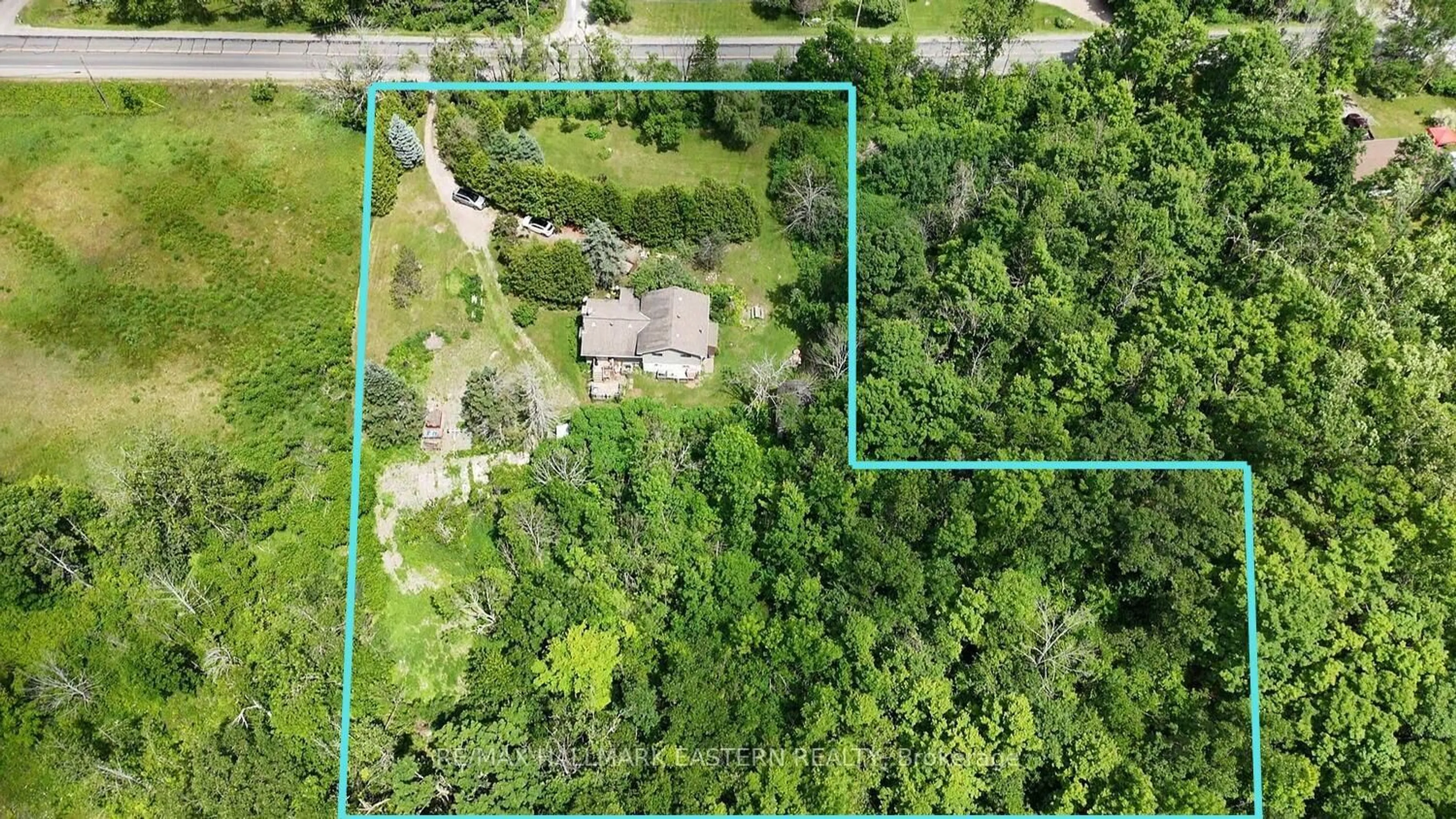 A pic from outside/outdoor area/front of a property/back of a property/a pic from drone, forest/trees view for 1076 County Road 40, Douro-Dummer Ontario K0L 2V0