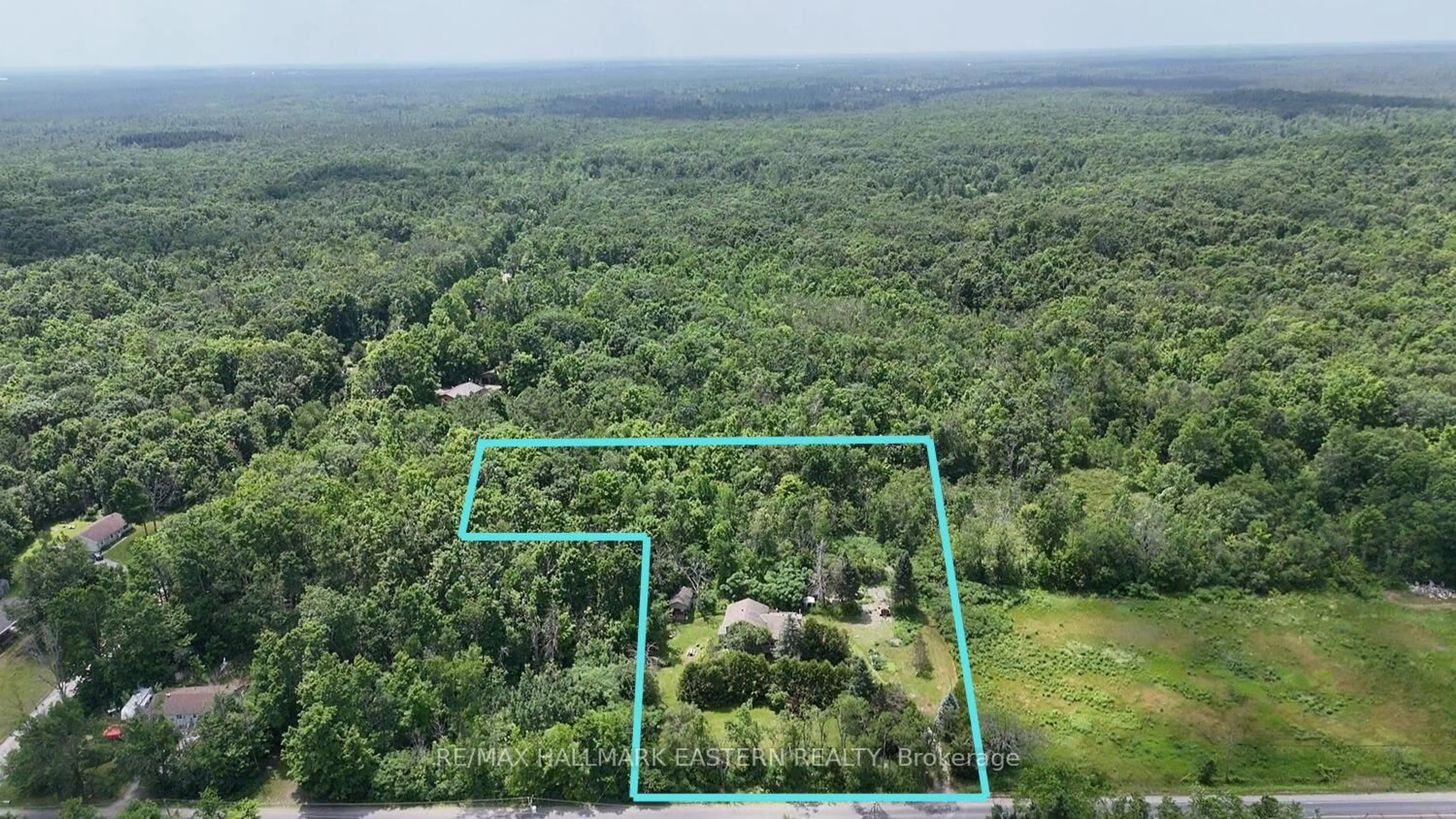 A pic from outside/outdoor area/front of a property/back of a property/a pic from drone, forest/trees view for 1076 County Road 40, Douro-Dummer Ontario K0L 2V0