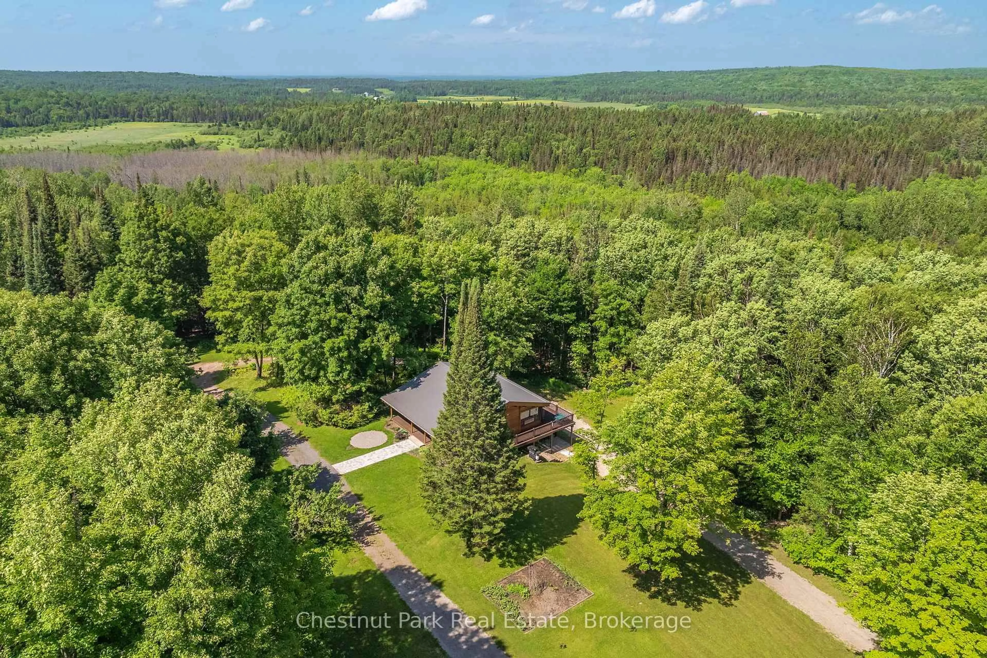 A pic from outside/outdoor area/front of a property/back of a property/a pic from drone, forest/trees view for 487 O'connor Line Rd, Powassan Ontario P0H 1Z0