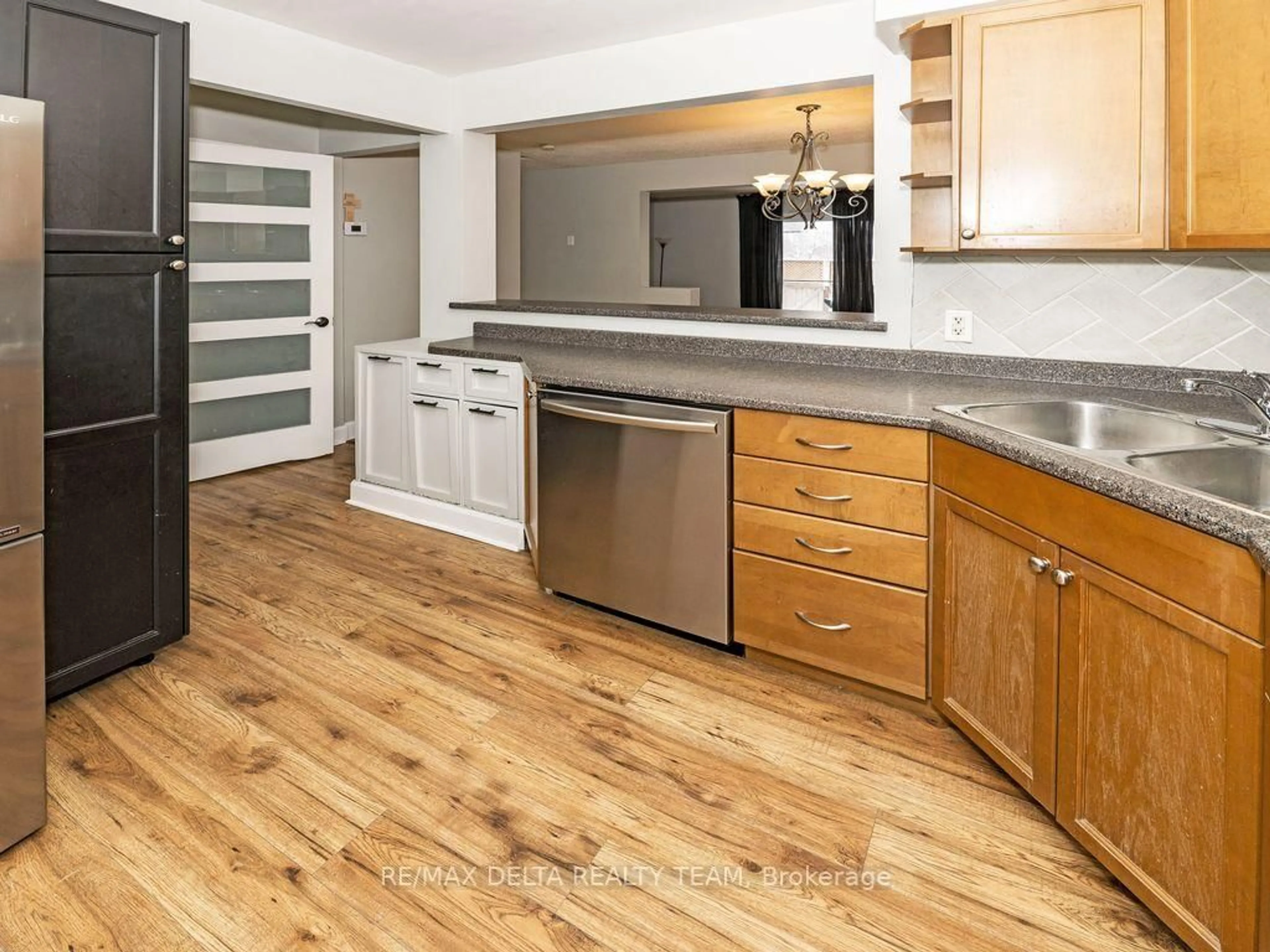 Open concept kitchen, wood/laminate floor for 3024 Fairlea Cres #-, Ottawa Ontario K1V 8T7