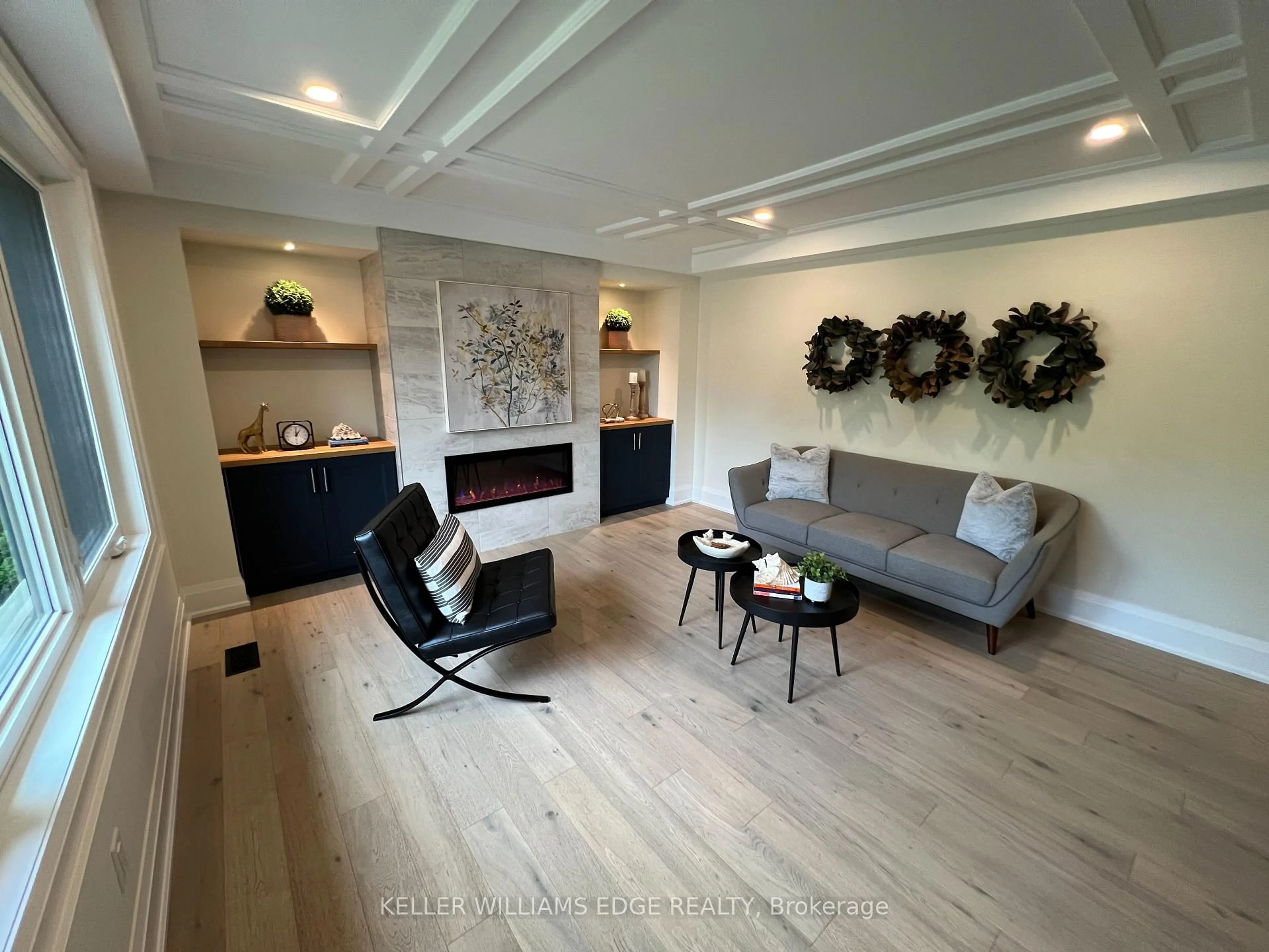 Living room with furniture, wood/laminate floor for 142 South Bend Rd, Hamilton Ontario L9A 2B6