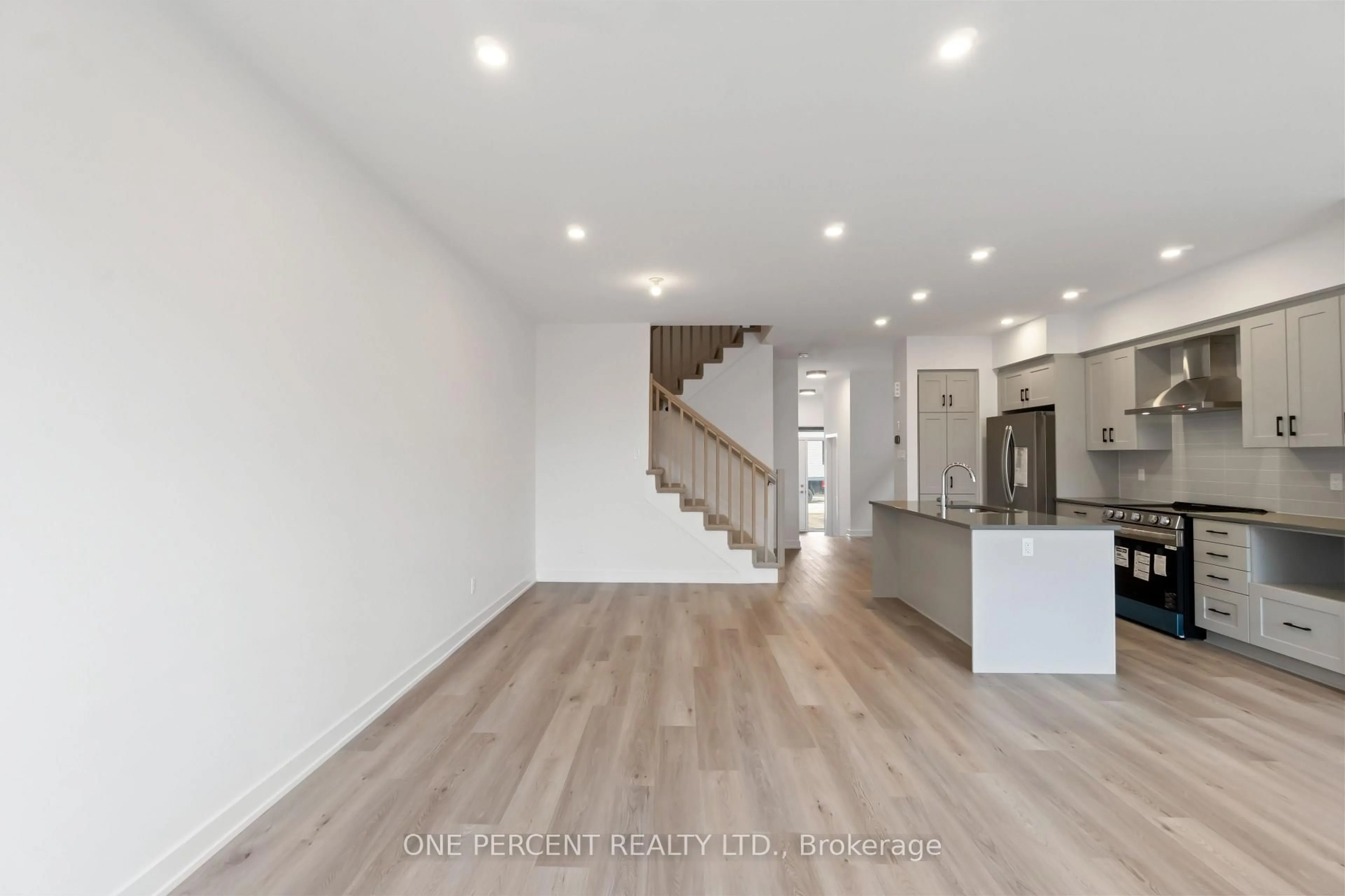 Open concept kitchen, wood/laminate floor for 99 Rappel Circ, Orleans Ontario K1W 0W3