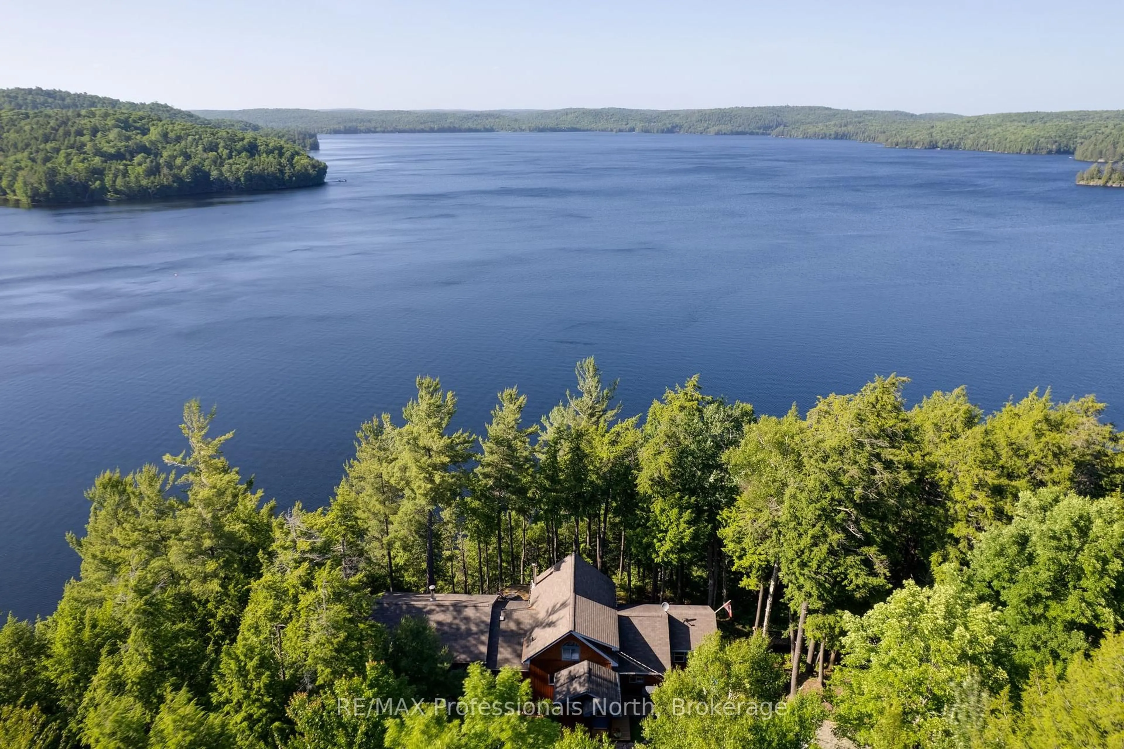 A pic from outside/outdoor area/front of a property/back of a property/a pic from drone, water/lake/river/ocean view for 1055 Boxstove Point Tr, Dysart et al Ontario K0M 1S0