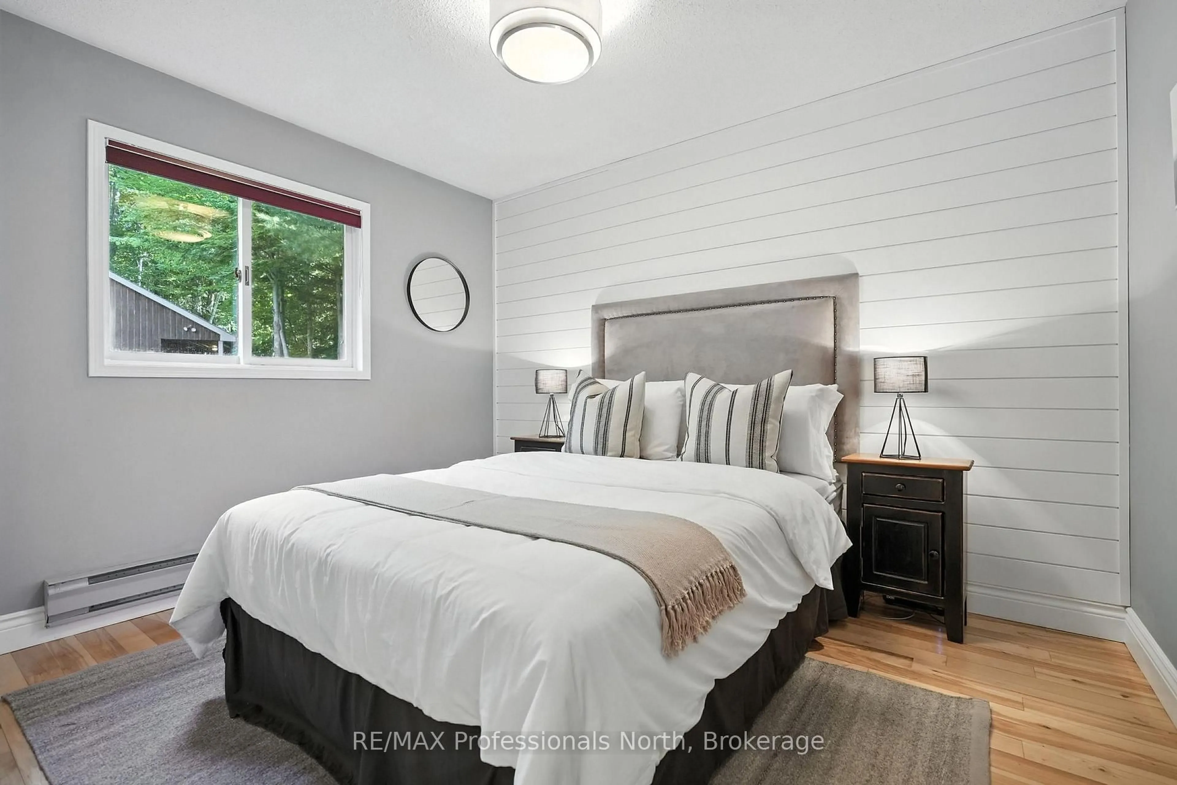 Bedroom with bed, wood/laminate floor for 1055 Boxstove Point Tr, Dysart et al Ontario K0M 1S0