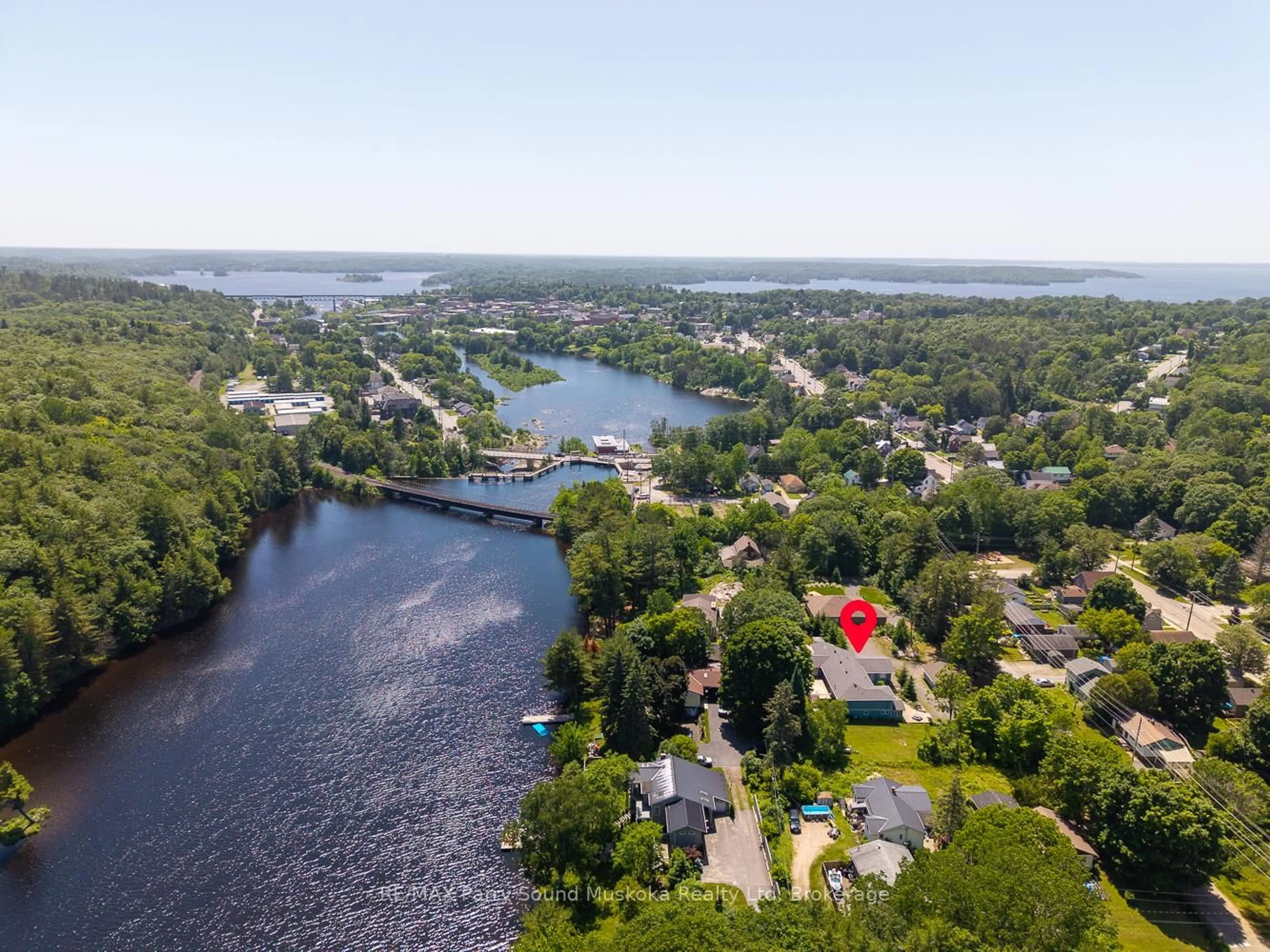 A pic from outside/outdoor area/front of a property/back of a property/a pic from drone, water/lake/river/ocean view for 9 Addie St, Parry Sound Ontario P2A 2J9